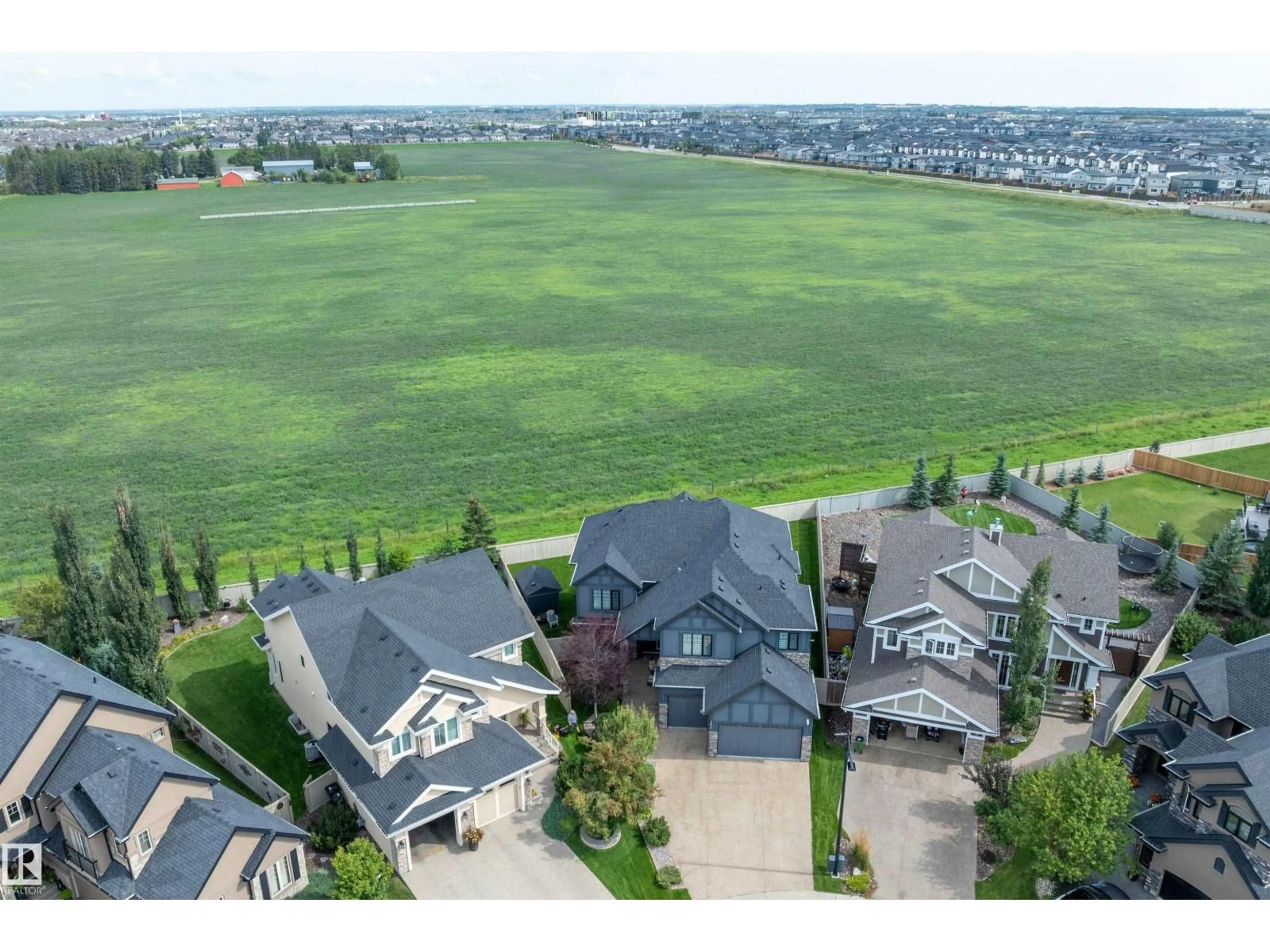 A pic from outside/outdoor area/front of a property/back of a property/a pic from drone, mountain view for 3009 KESWICK WY, Edmonton Alberta T6W2P7