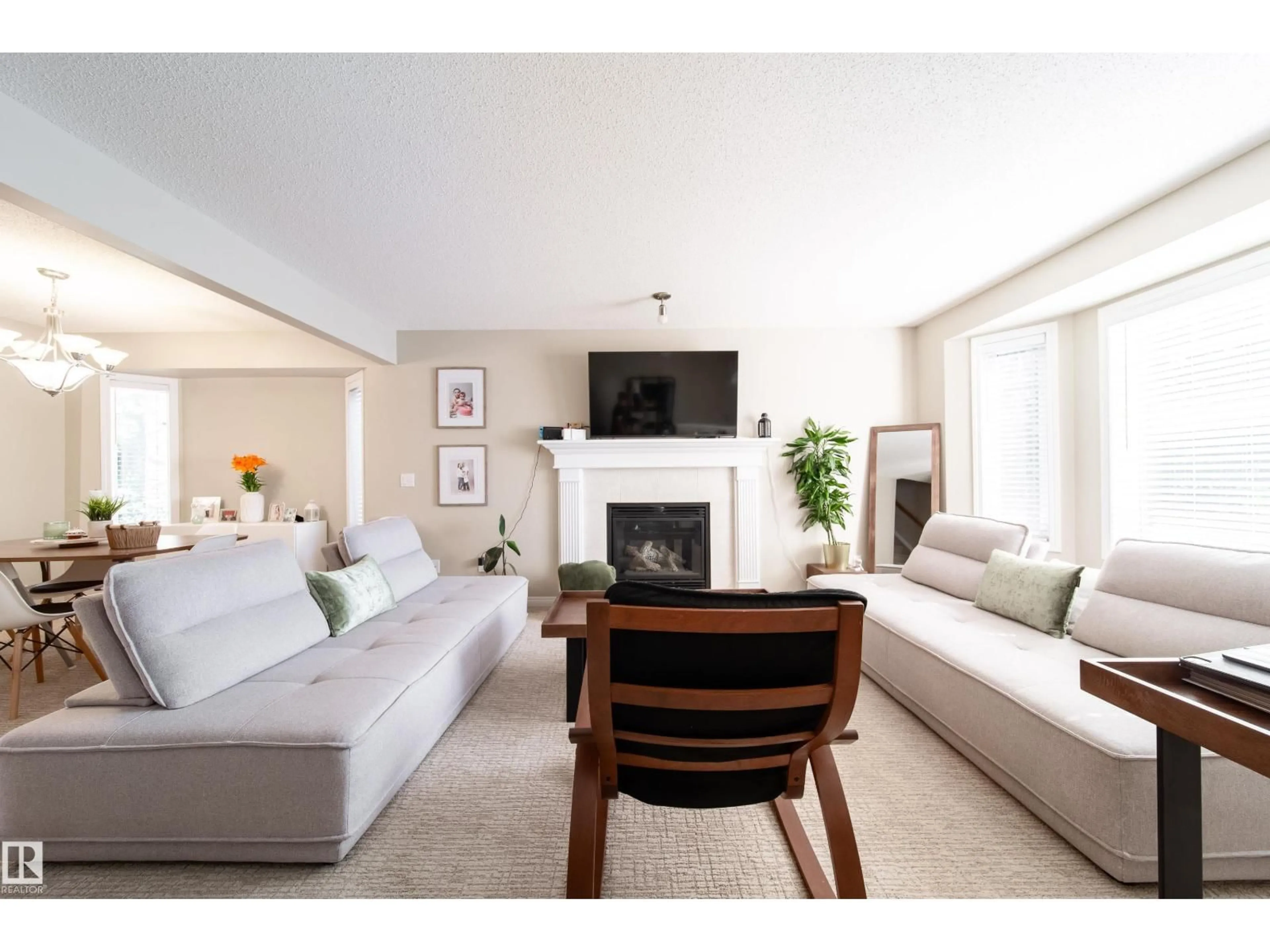 Living room with furniture, unknown for NW - 8118-8120 81 AV, Edmonton Alberta T6C0V9