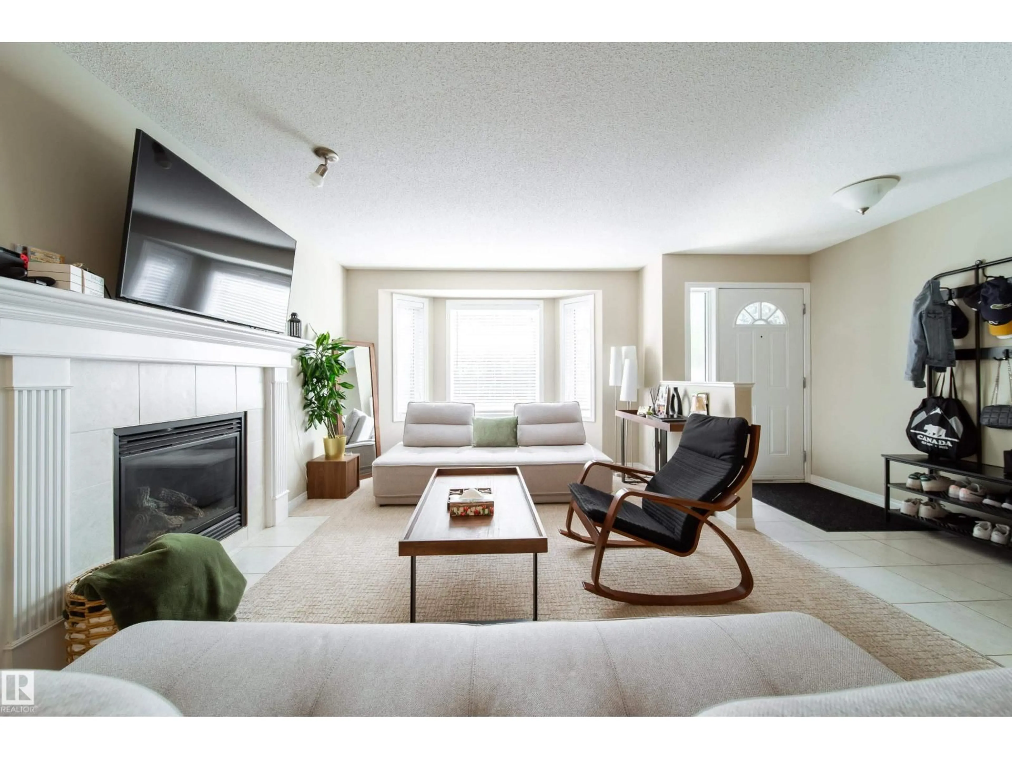 Living room with furniture, unknown for NW - 8118-8120 81 AV, Edmonton Alberta T6C0V9