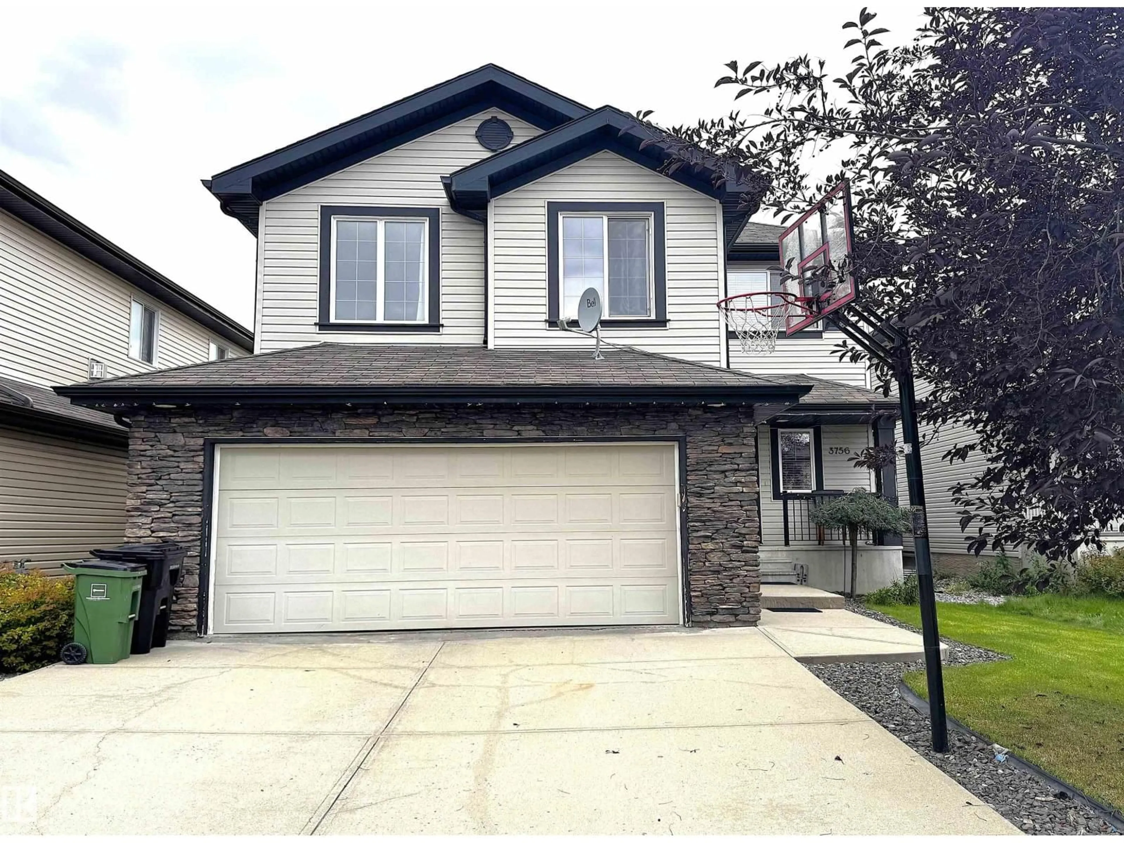 Home with vinyl exterior material, street for 3756 13 ST, Edmonton Alberta T6T0E5