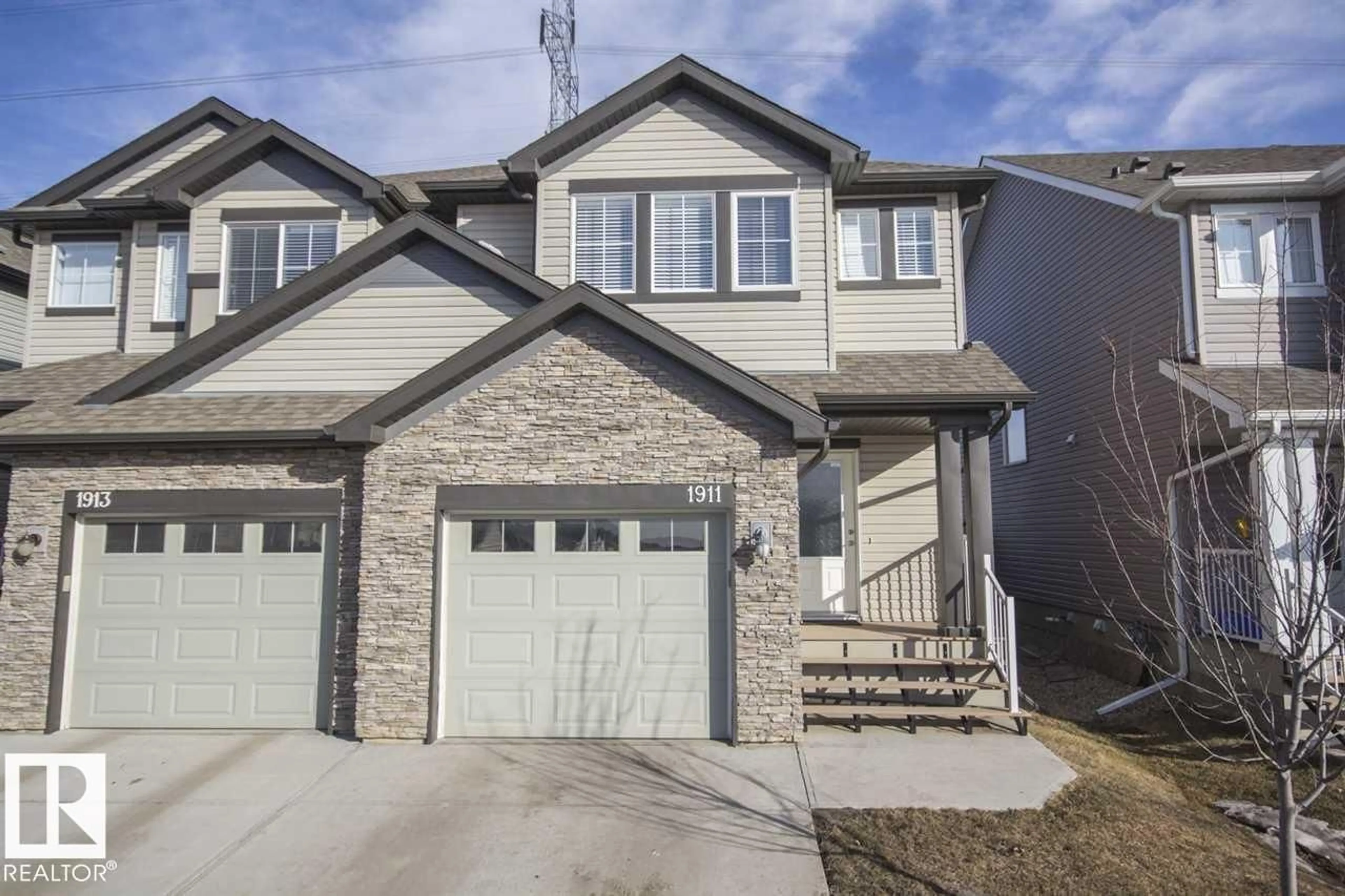 Home with vinyl exterior material, street for 1911 28 ST, Edmonton Alberta T6T0N5