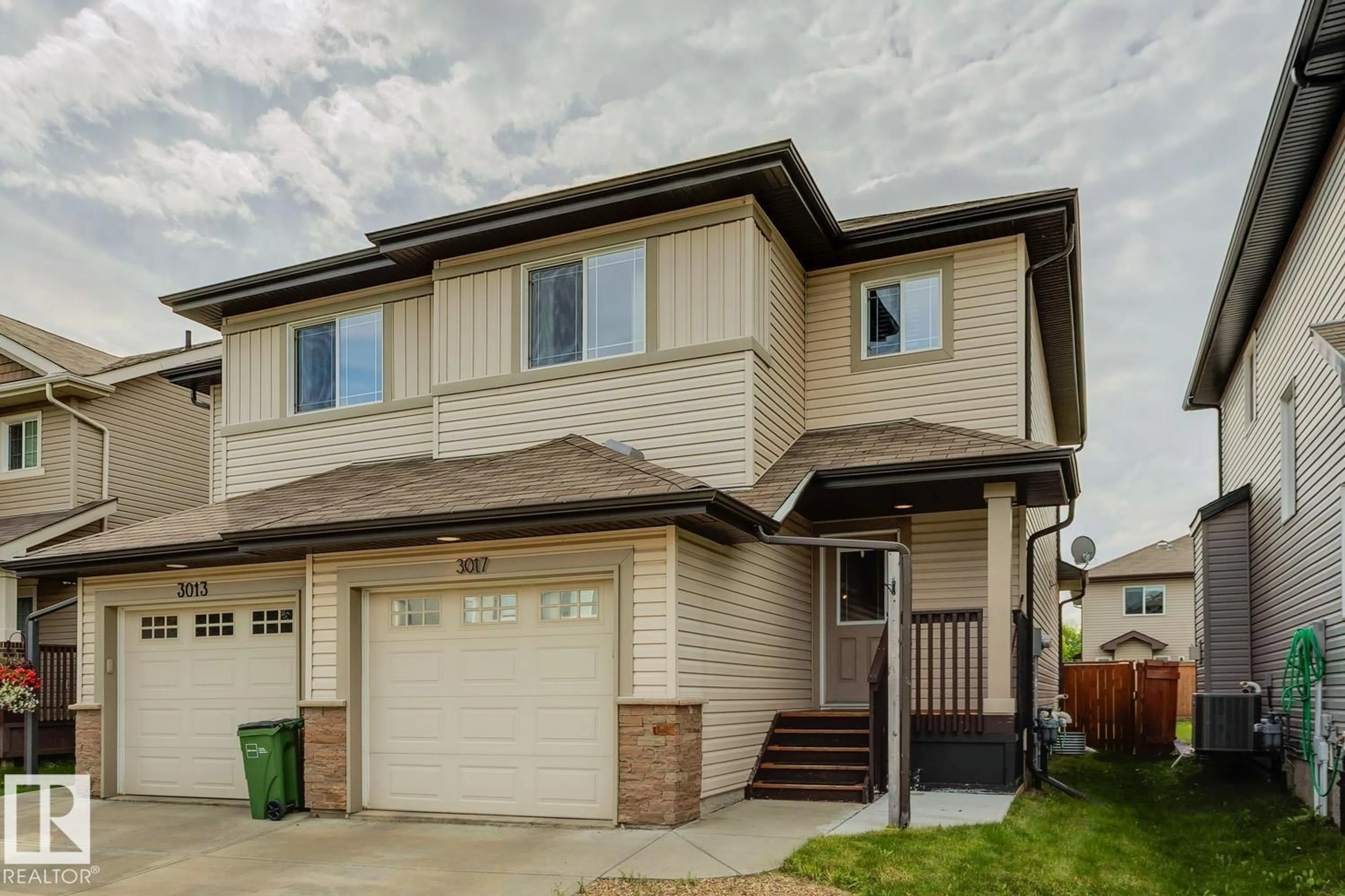 Home with vinyl exterior material, street for 3017 16A AV, Edmonton Alberta T6T0P8