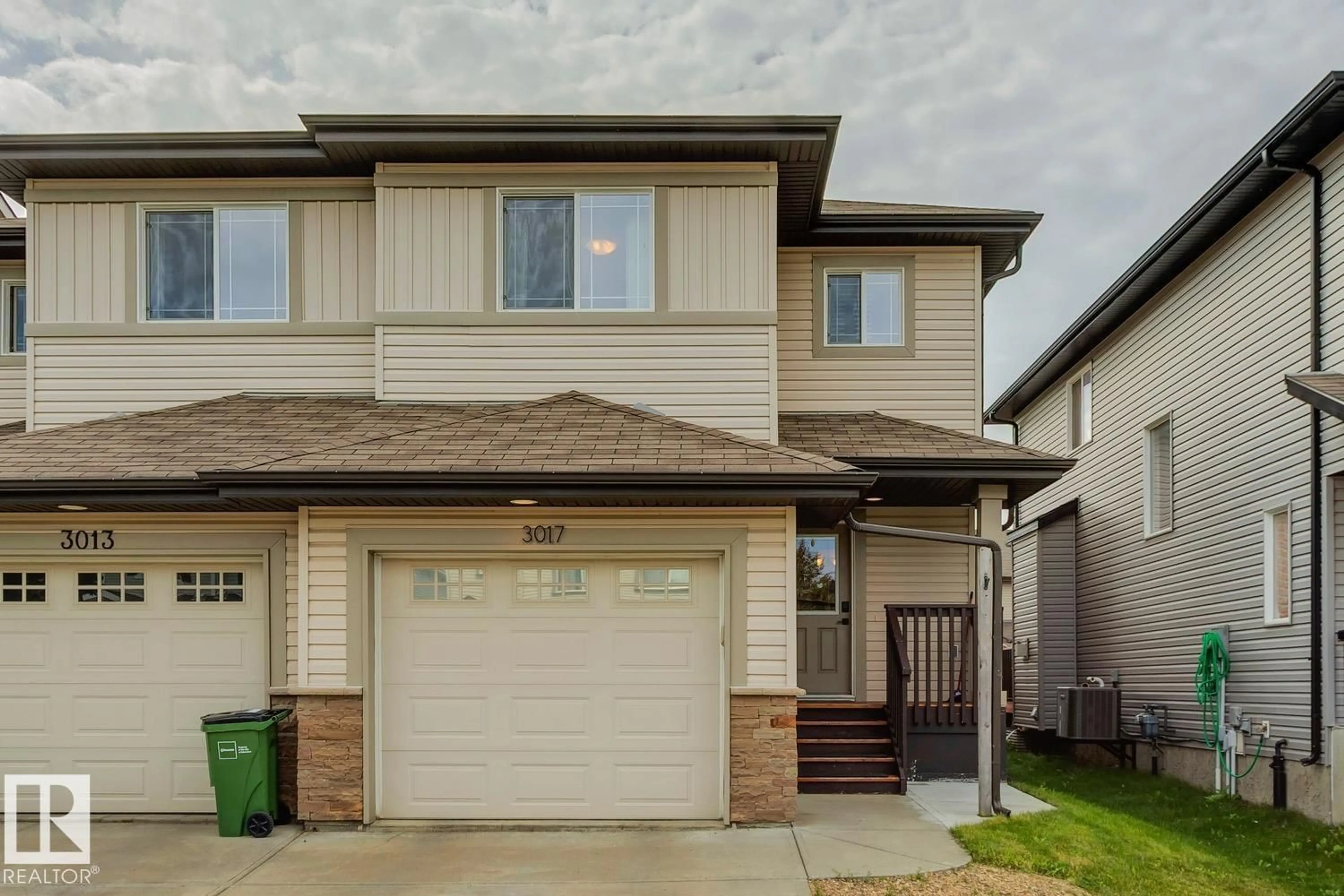 Home with vinyl exterior material, street for 3017 16A AV, Edmonton Alberta T6T0P8