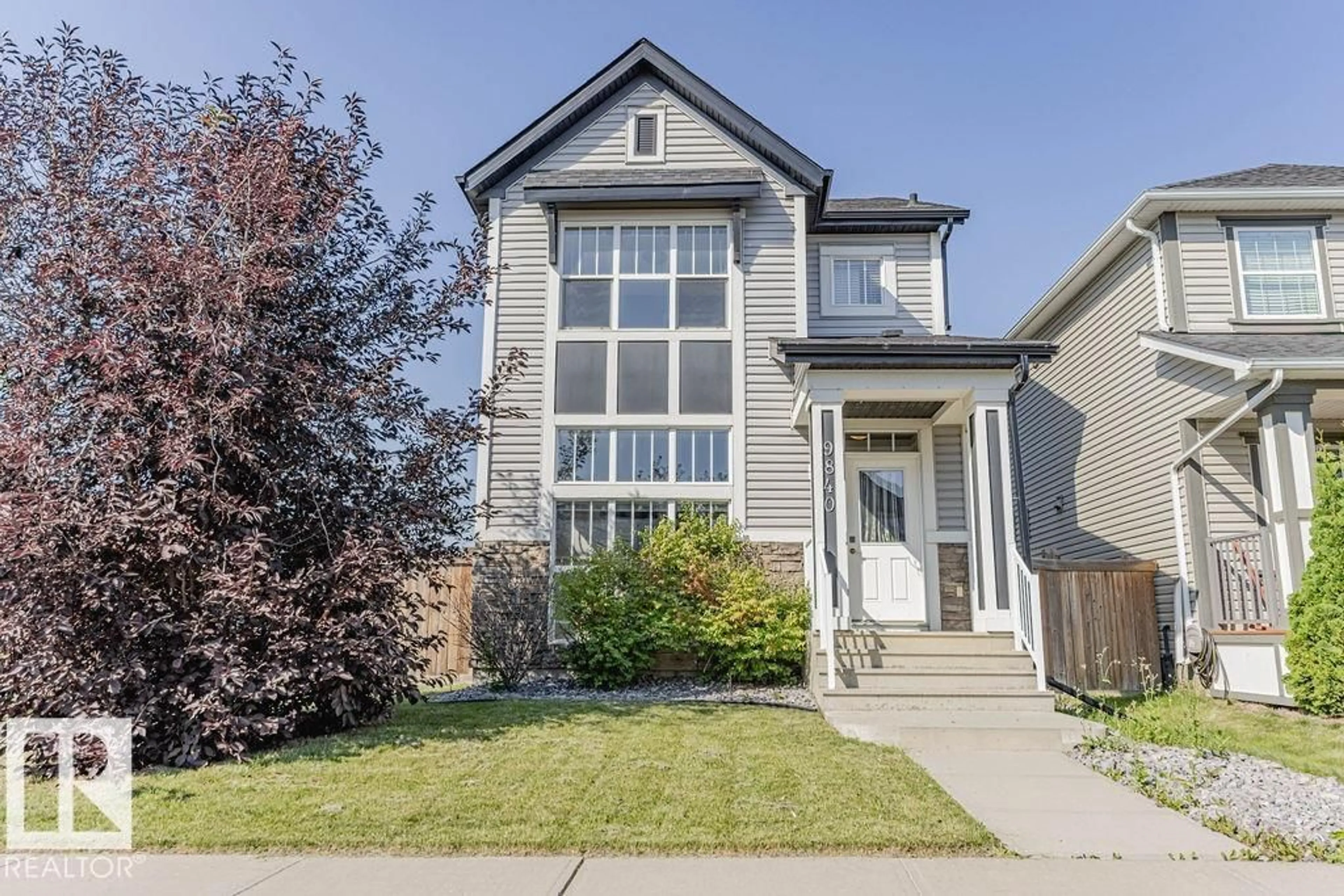 Home with vinyl exterior material, street for 9840 220 ST, Edmonton Alberta T5T4M3