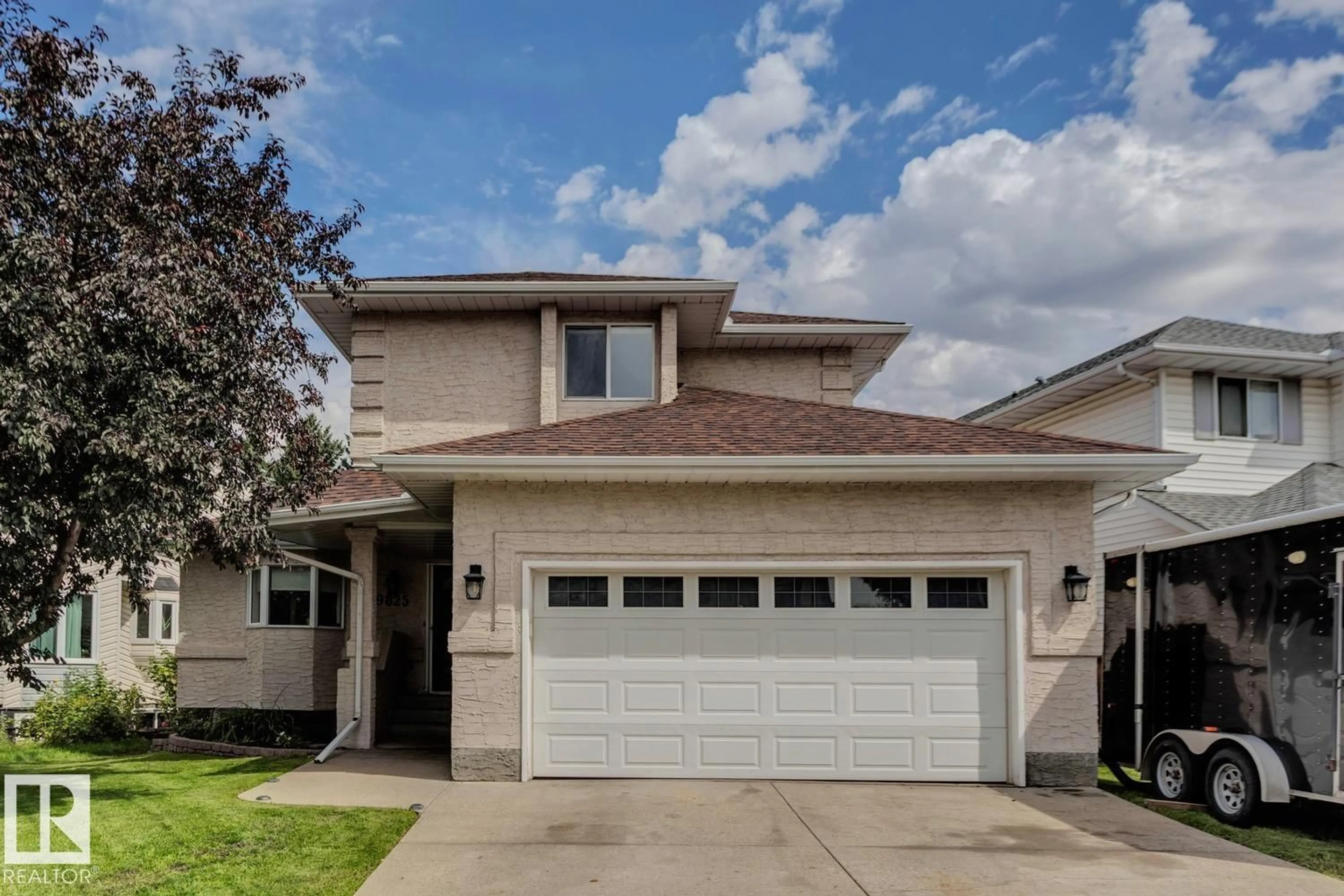 Home with vinyl exterior material, street for 9825 183 ST, Edmonton Alberta T5T4J1