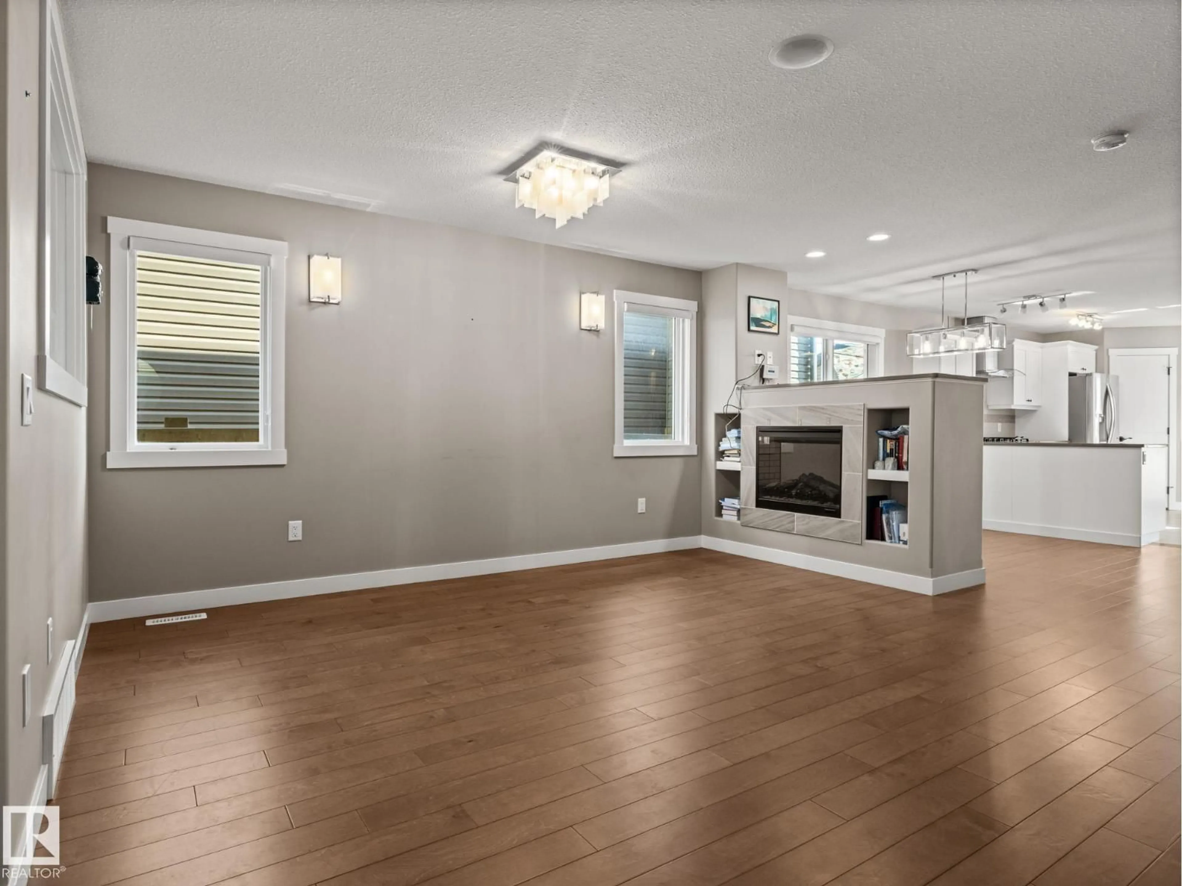 Living room with furniture, wood/laminate floor for NW - 11315 123 ST, Edmonton Alberta T5M0G1