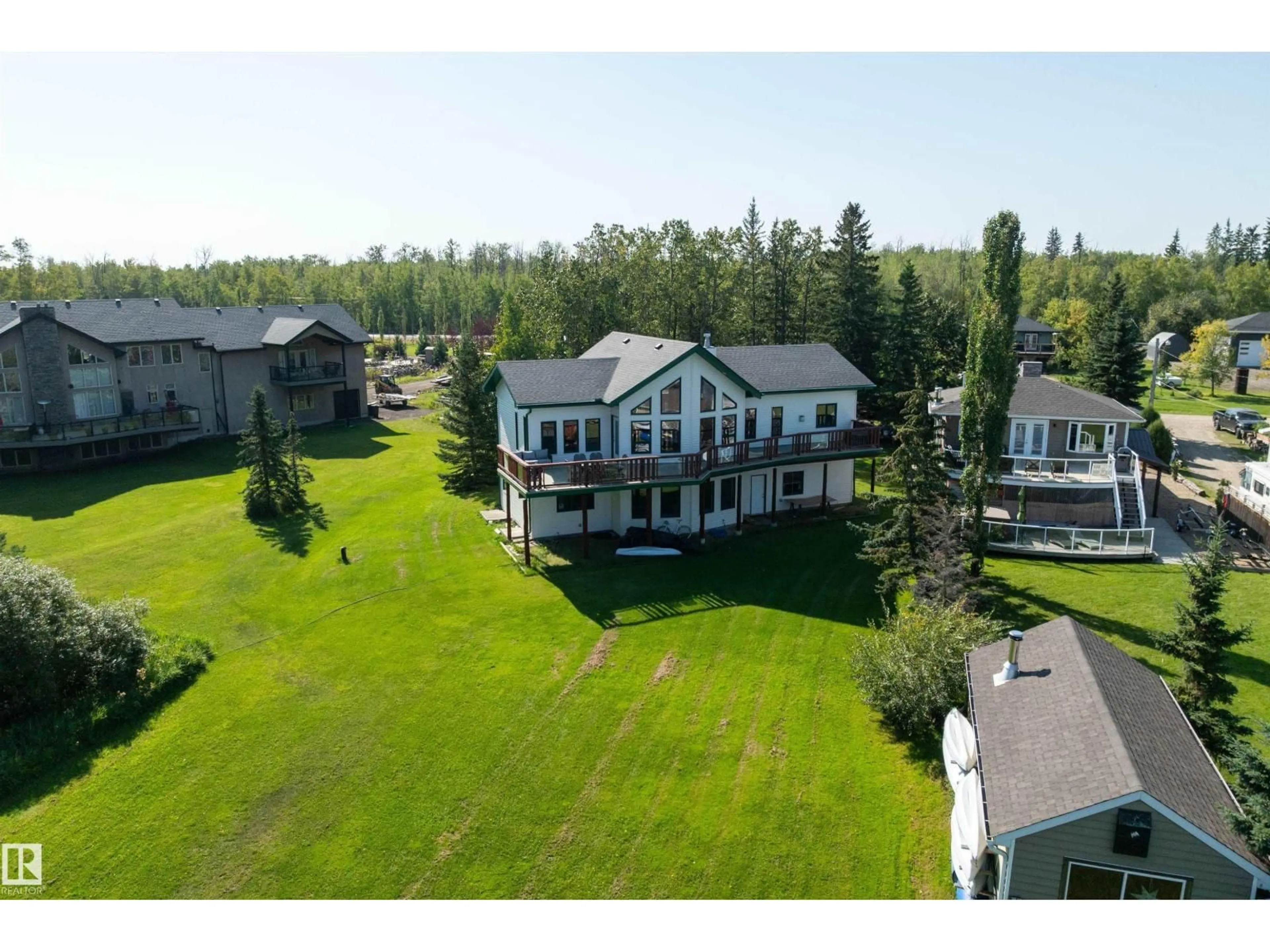 A pic from outside/outdoor area/front of a property/back of a property/a pic from drone, water/lake/river/ocean view for 120 48003 RR271, Rural Leduc County Alberta T0C2P0