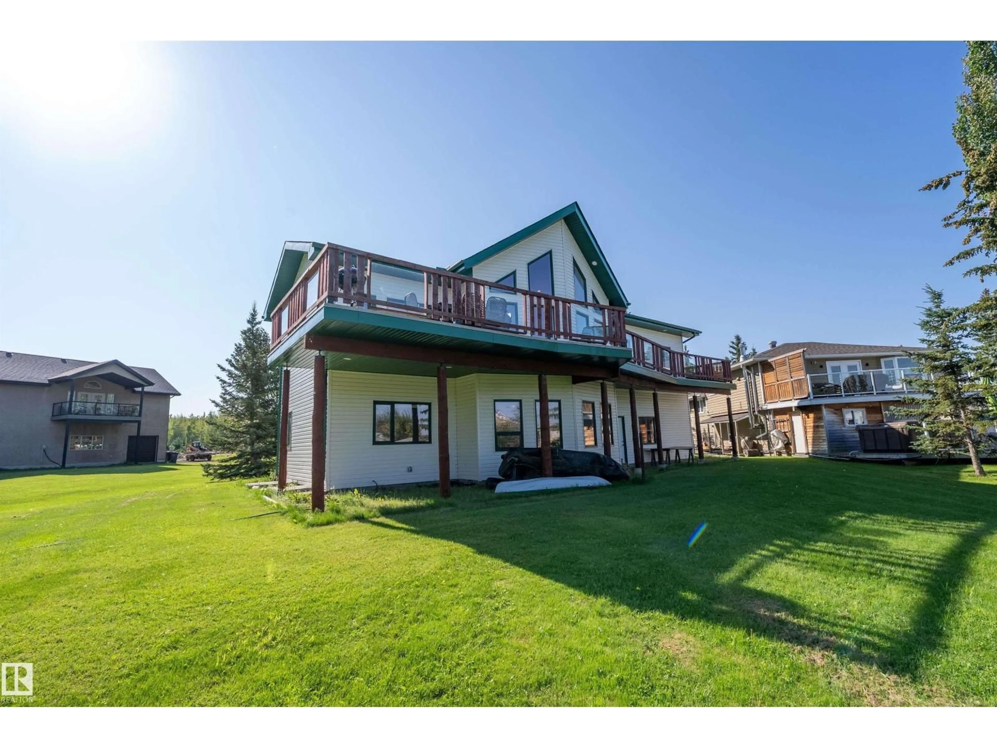 A pic from outside/outdoor area/front of a property/back of a property/a pic from drone, water/lake/river/ocean view for 120 48003 RR271, Rural Leduc County Alberta T0C2P0