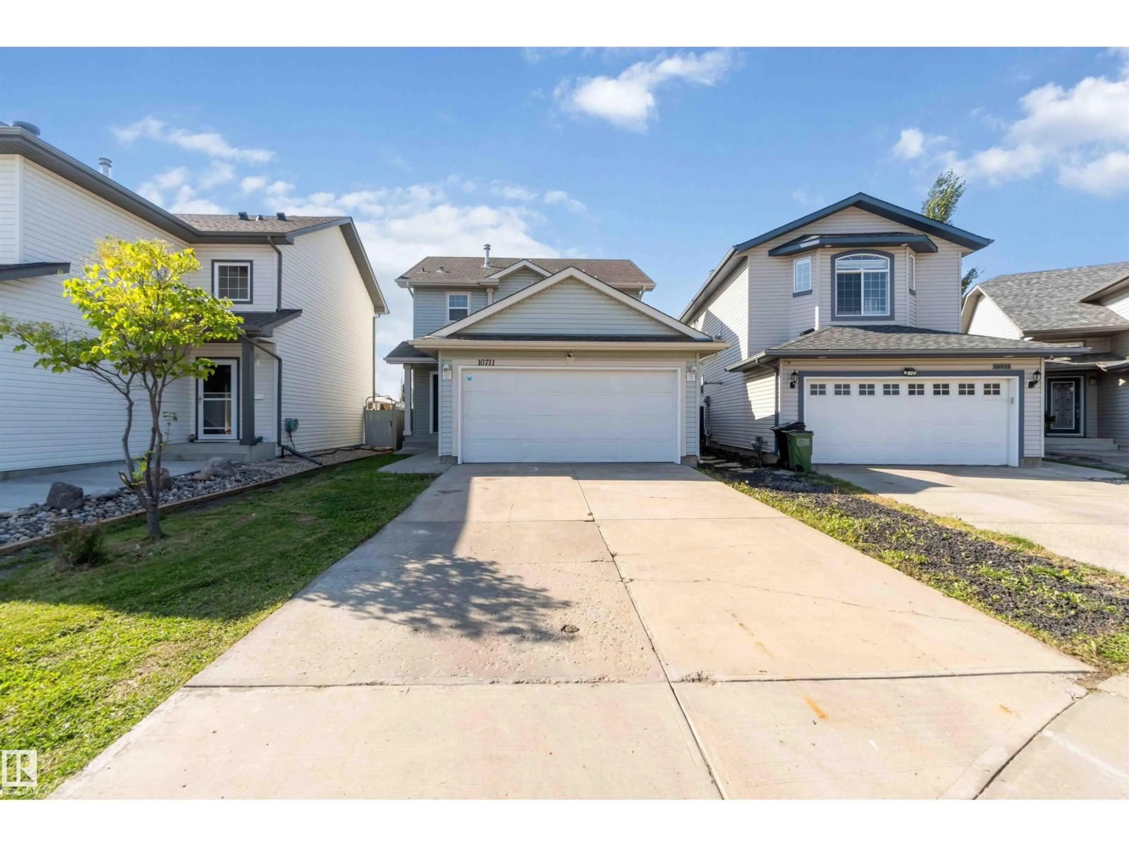Home with vinyl exterior material, street for NW - 10711 180 AV, Edmonton Alberta T5X6C9