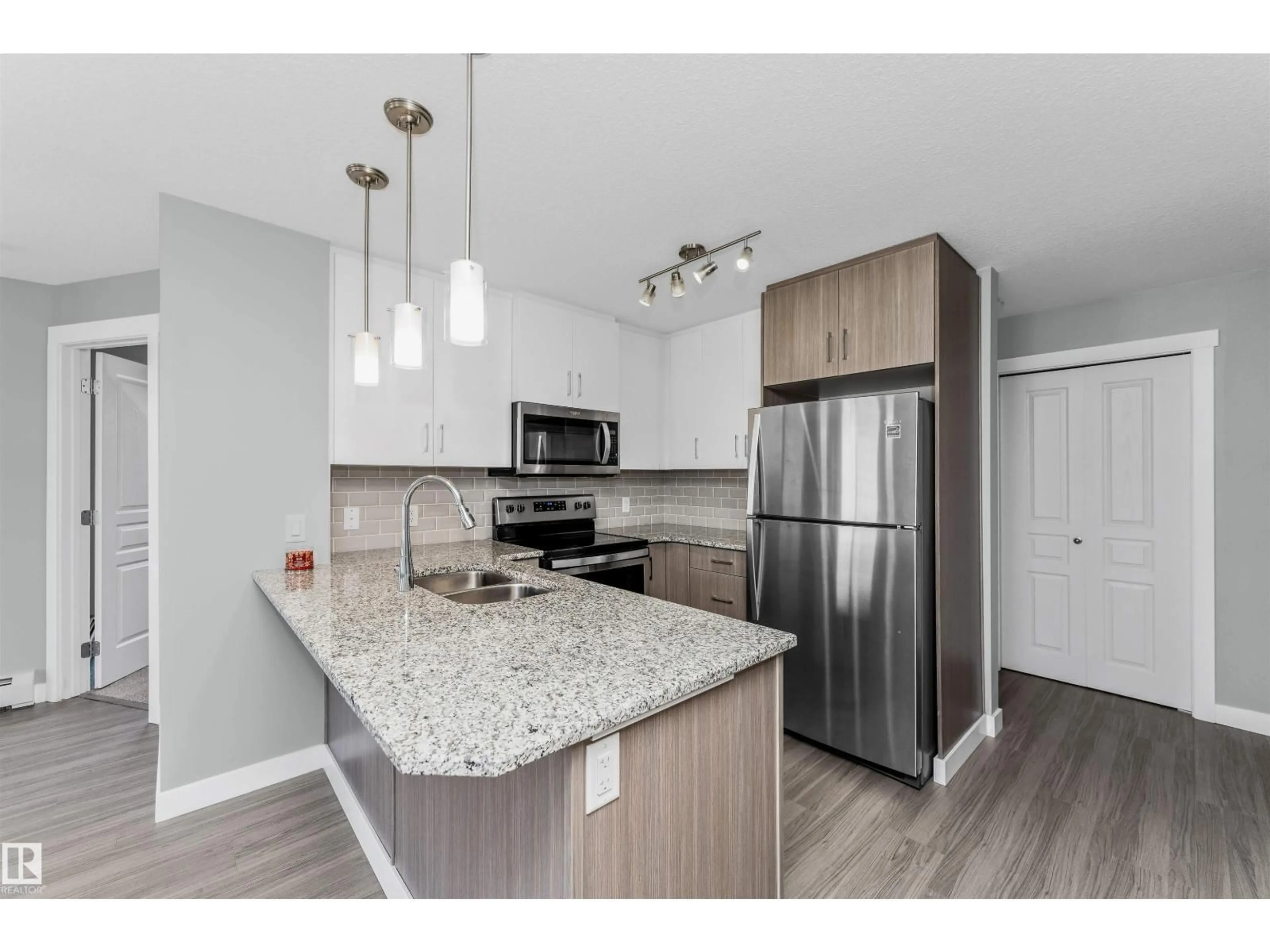 Open concept kitchen, unknown for 301 - 3670 139 AV NW, Edmonton Alberta T5Y3N5