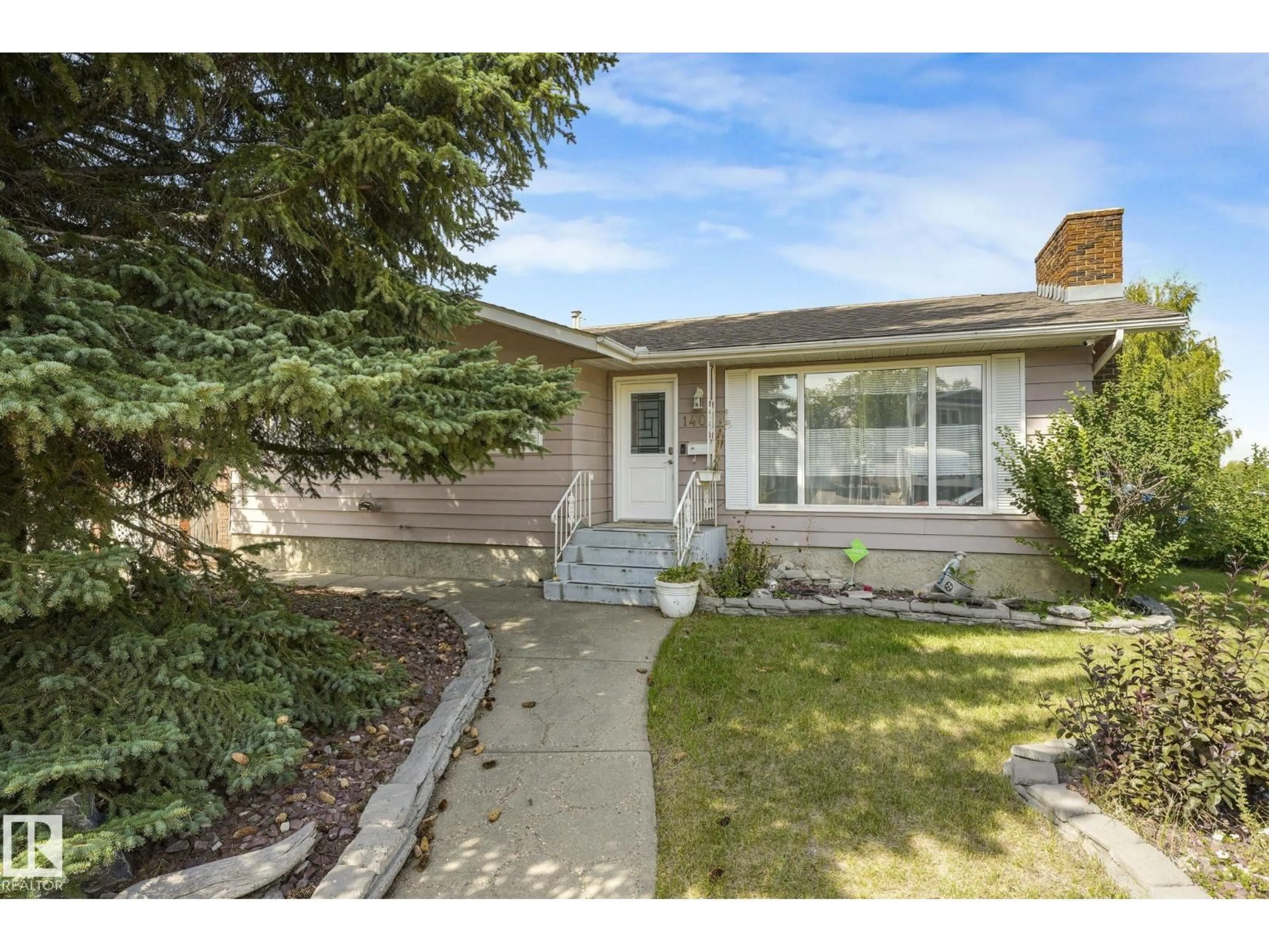 Home with vinyl exterior material, street for 1408 76 ST, Edmonton Alberta T6K2R9