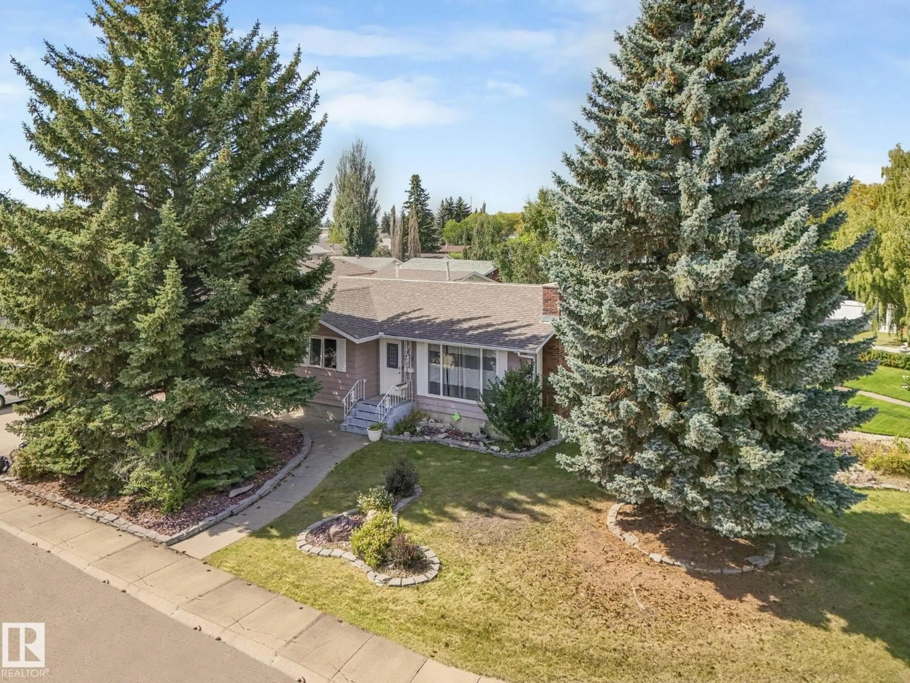A pic from outside/outdoor area/front of a property/back of a property/a pic from drone, mountain view for 1408 76 ST, Edmonton Alberta T6K2R9