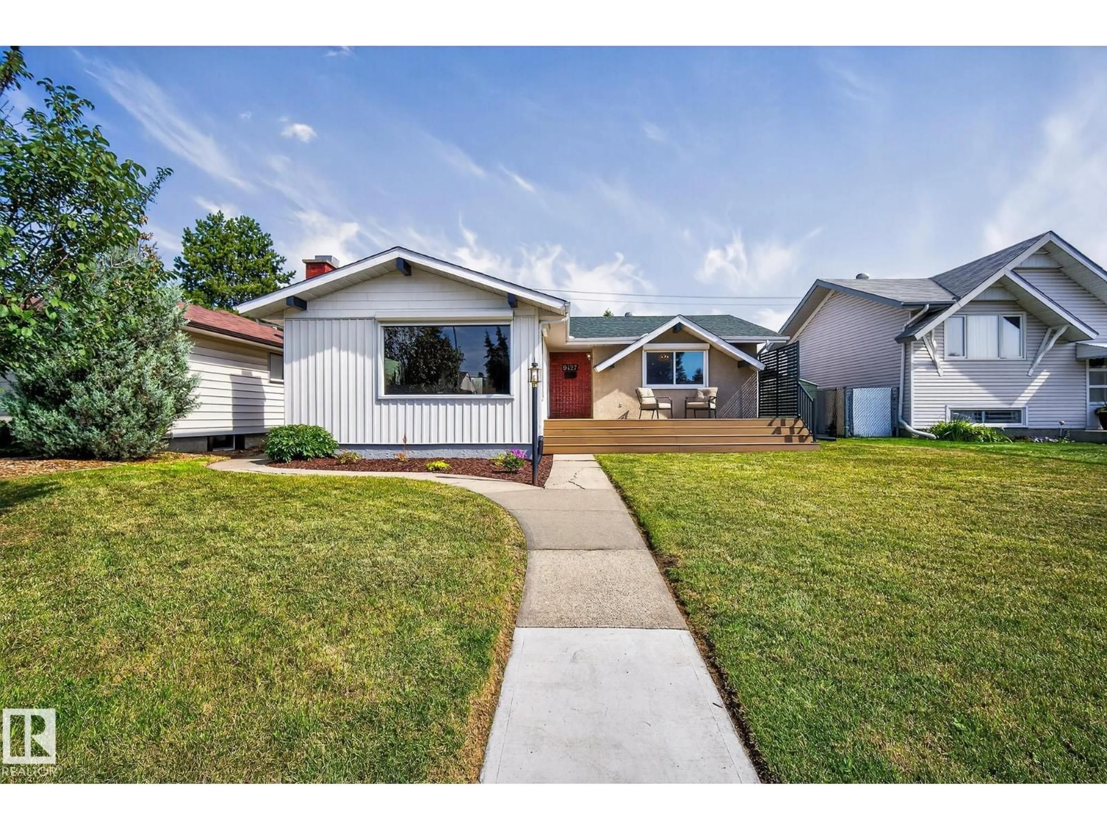 Home with vinyl exterior material, street for 9427 74 ST, Edmonton Alberta T6B2B5