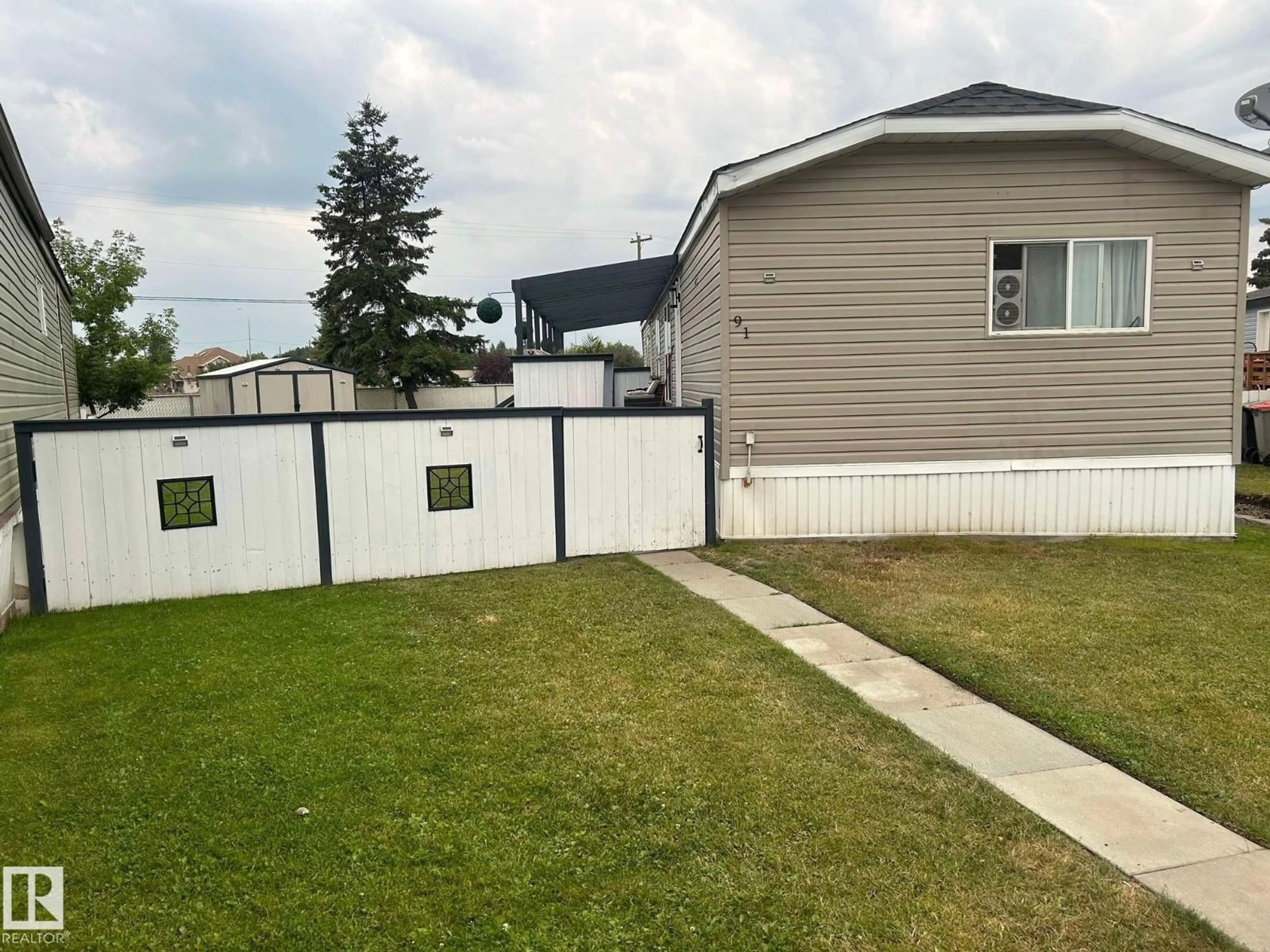 A pic from outside/outdoor area/front of a property/back of a property/a pic from drone, street for #91 - 4819 51 AV, Millet Alberta T0C1Z0