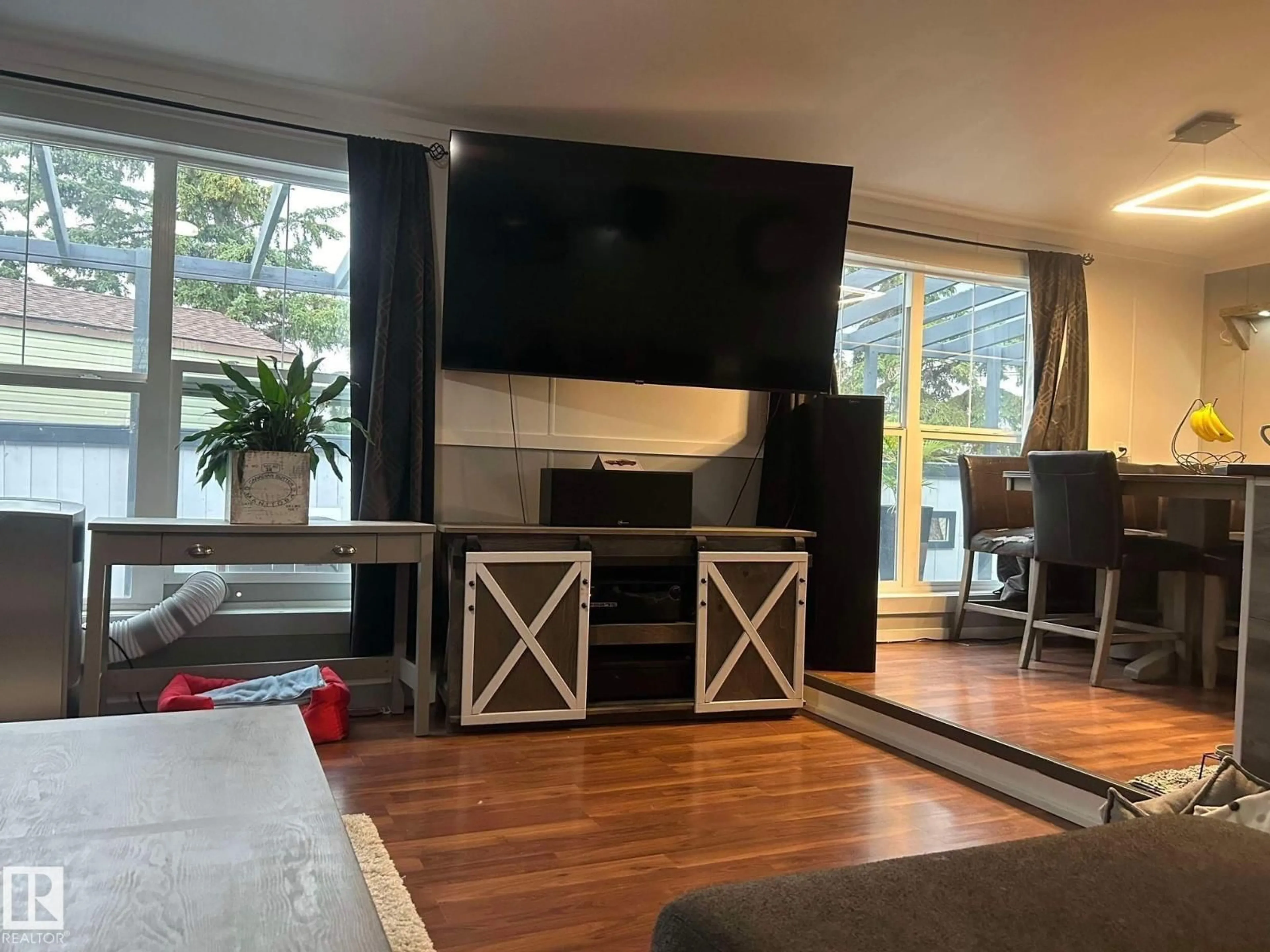Living room with furniture, wood/laminate floor for #91 - 4819 51 AV, Millet Alberta T0C1Z0