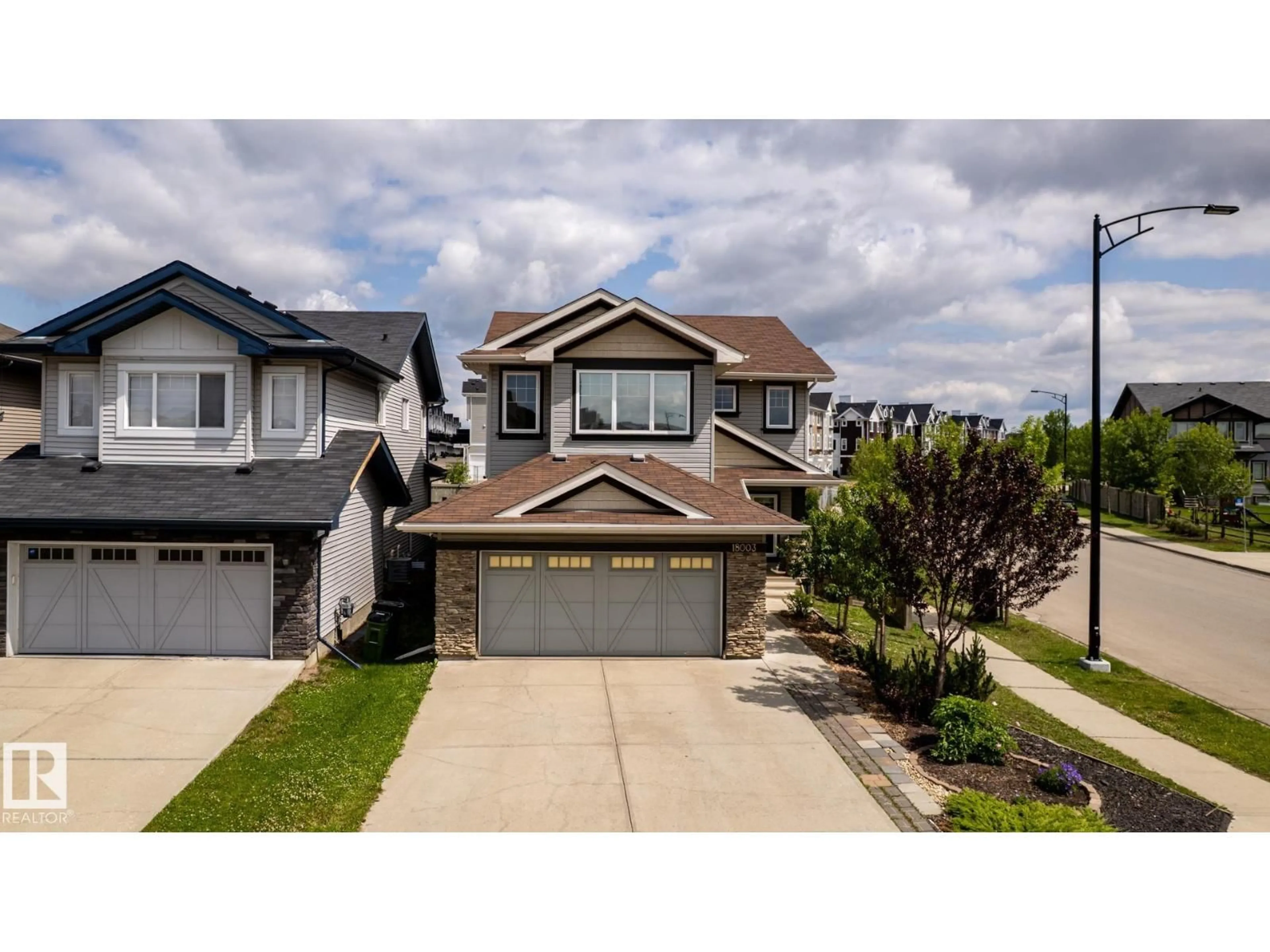 Home with vinyl exterior material, street for 18003 77 ST, Edmonton Alberta T5Z0L1