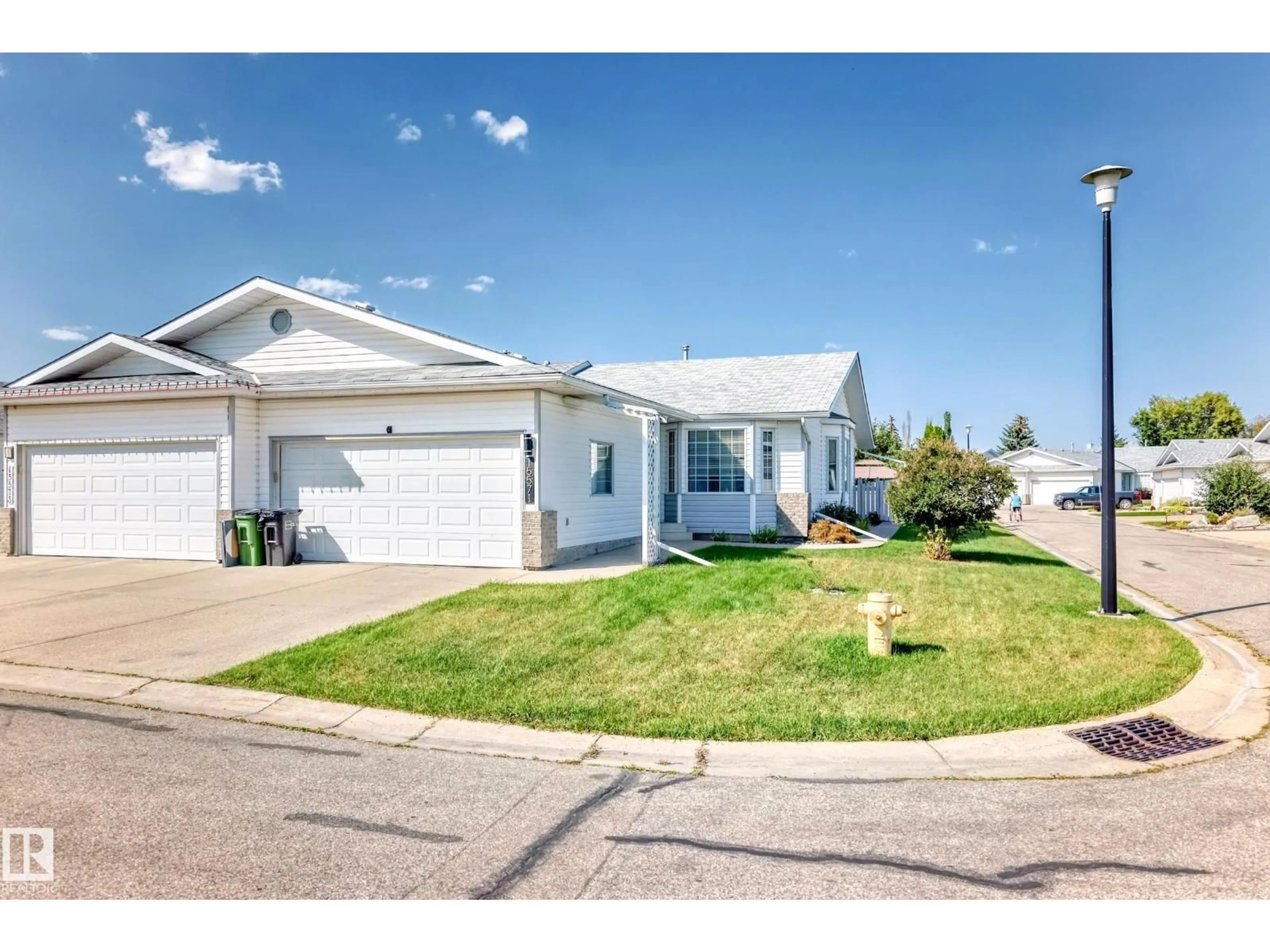Home with vinyl exterior material, street for NW - 15571 59A ST, Edmonton Alberta T5Y2N9