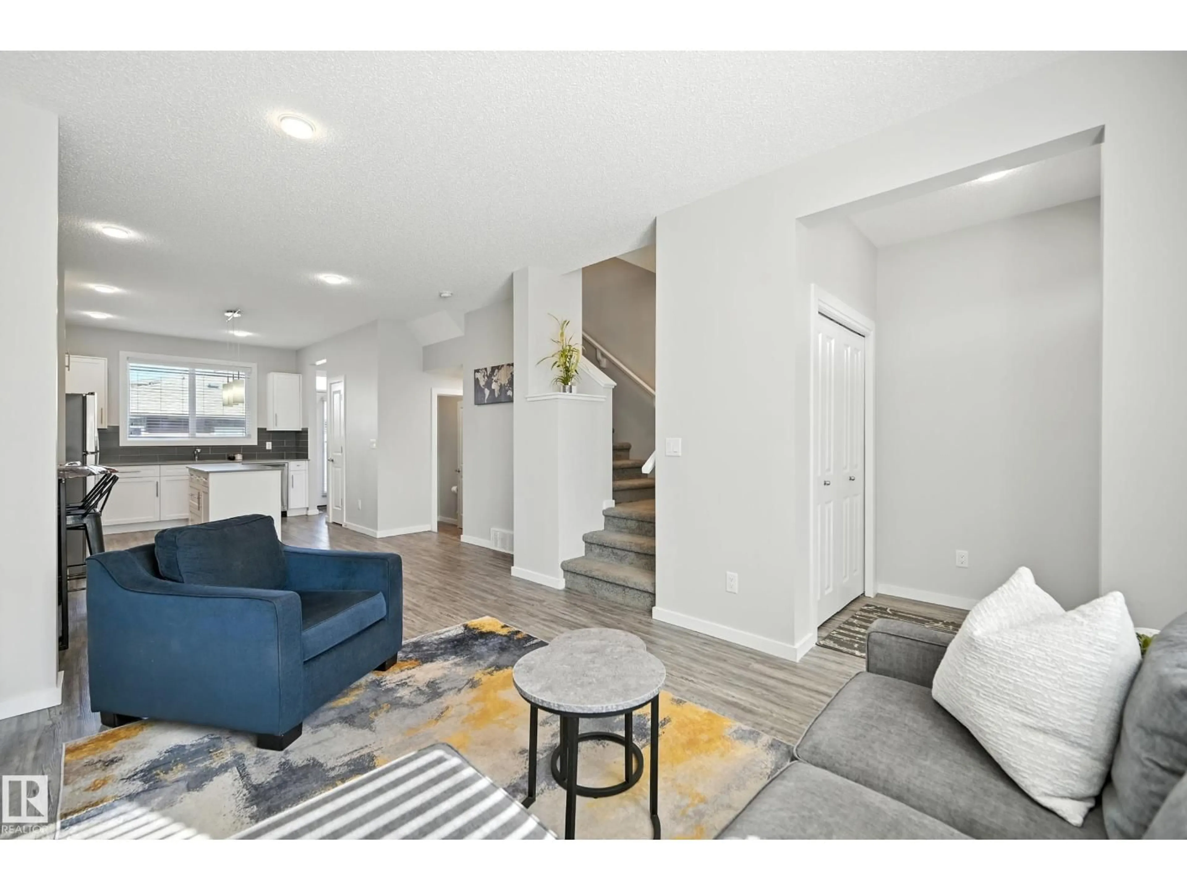 Living room with furniture, unknown for NW - 2625 202 ST, Edmonton Alberta T6M1K5