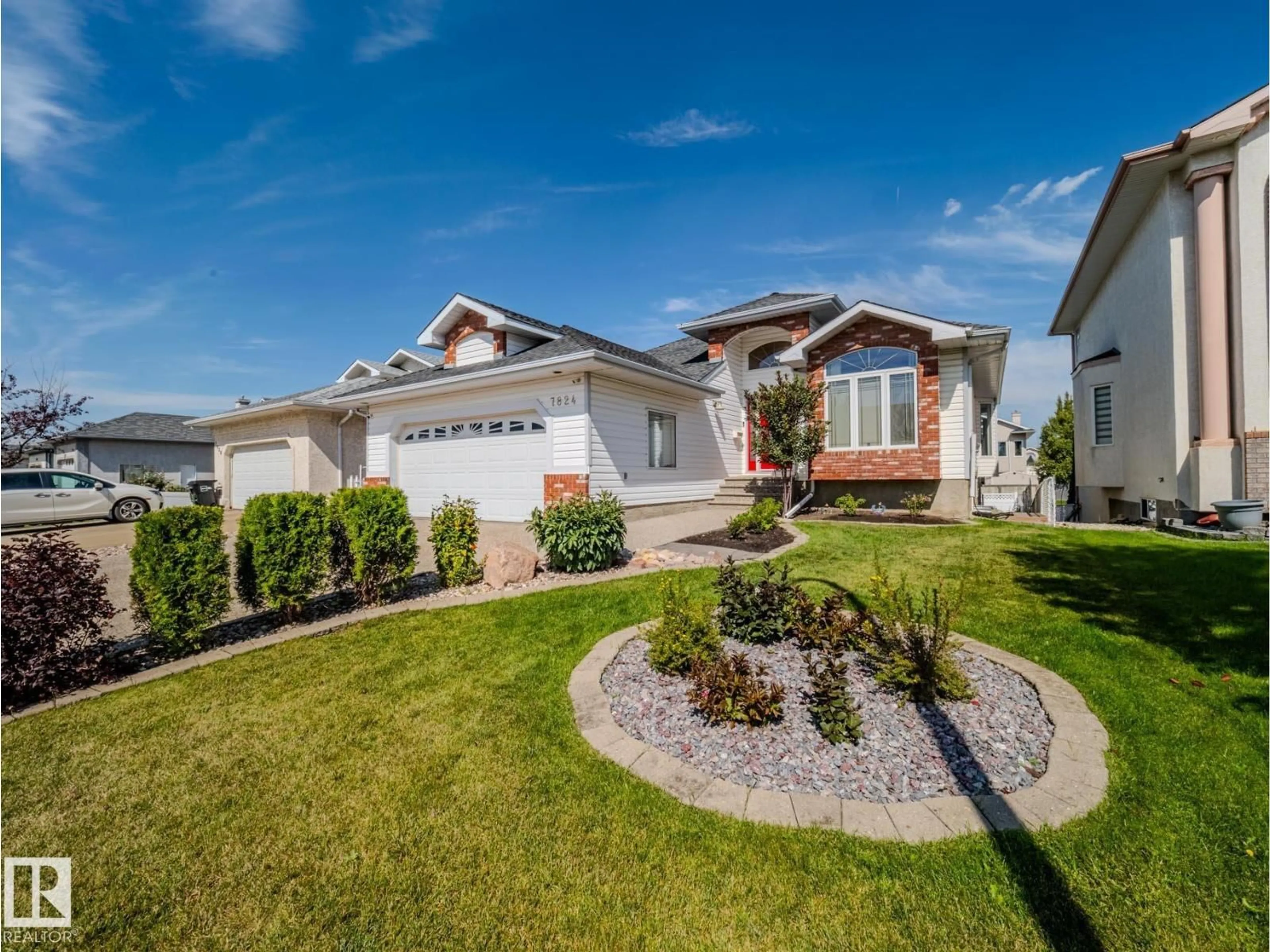 Home with vinyl exterior material, street for 7824 165 AV, Edmonton Alberta T5Z3J6