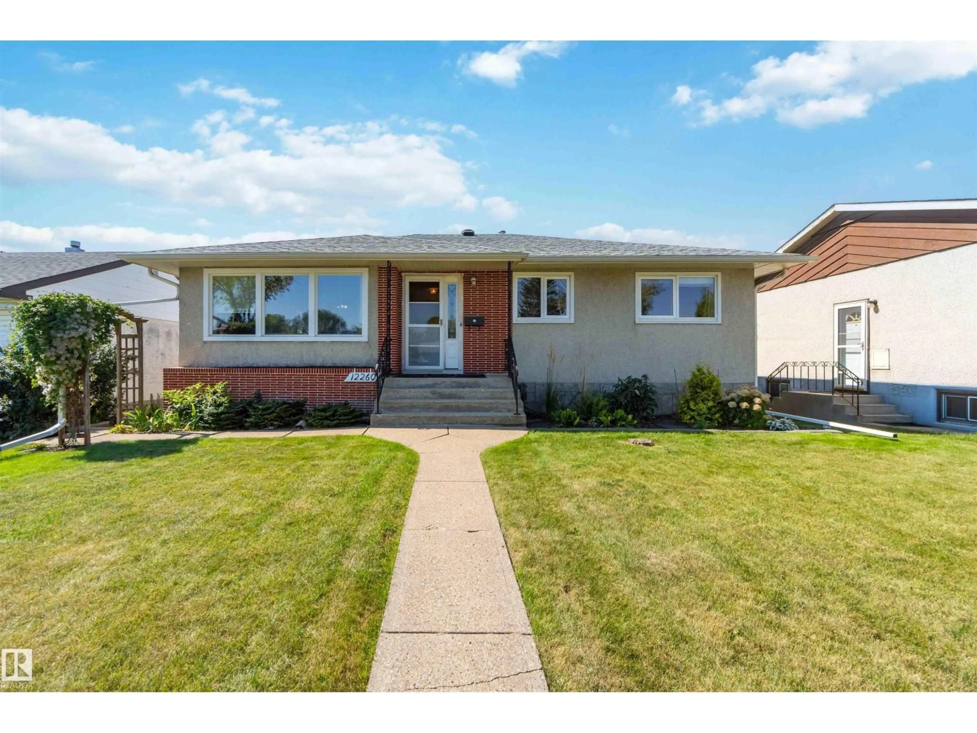 Home with vinyl exterior material, street for 12260 ST.ALBERT TR, Edmonton Alberta T5L4G6