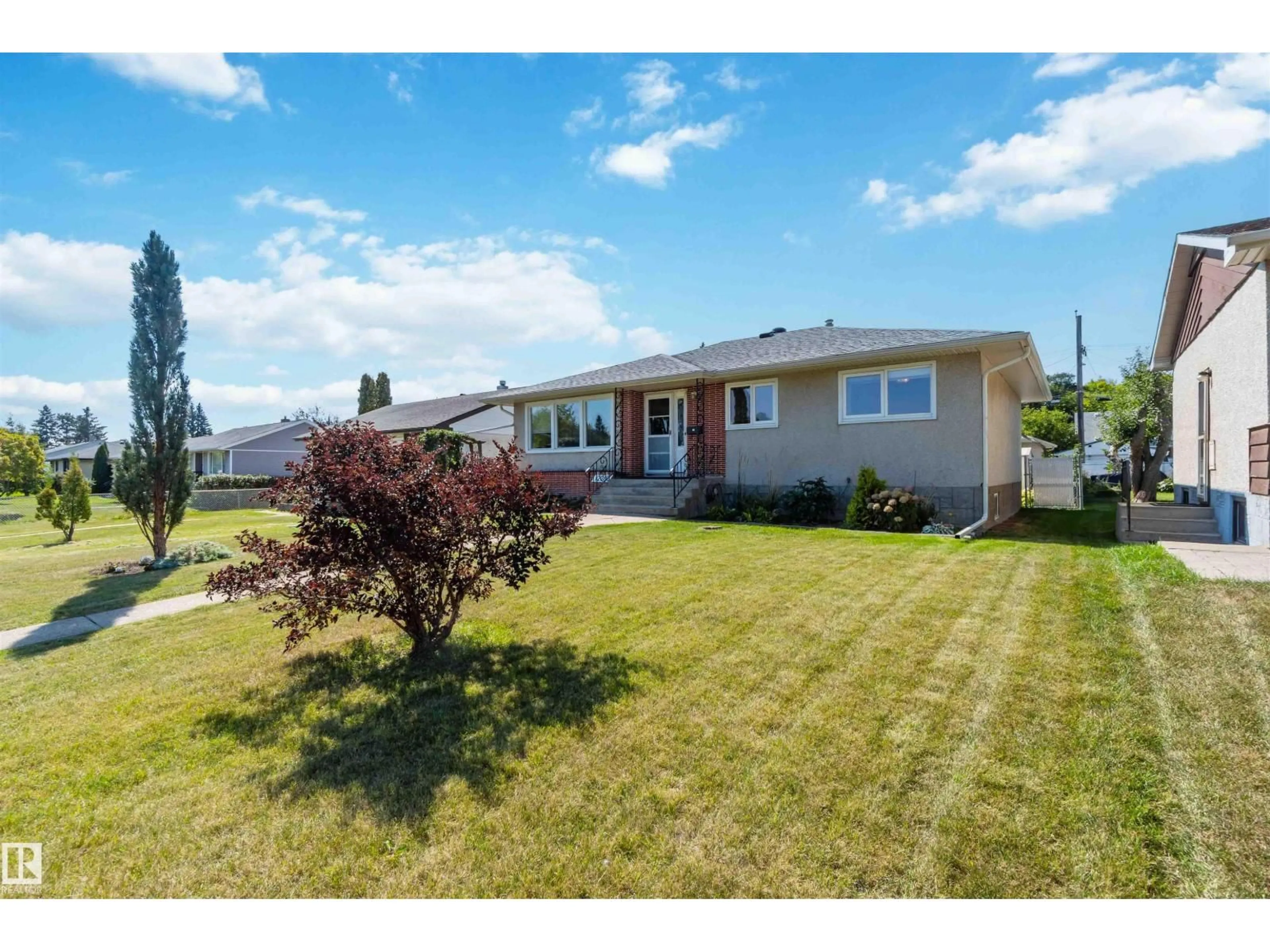 Home with vinyl exterior material, street for 12260 ST.ALBERT TR, Edmonton Alberta T5L4G6