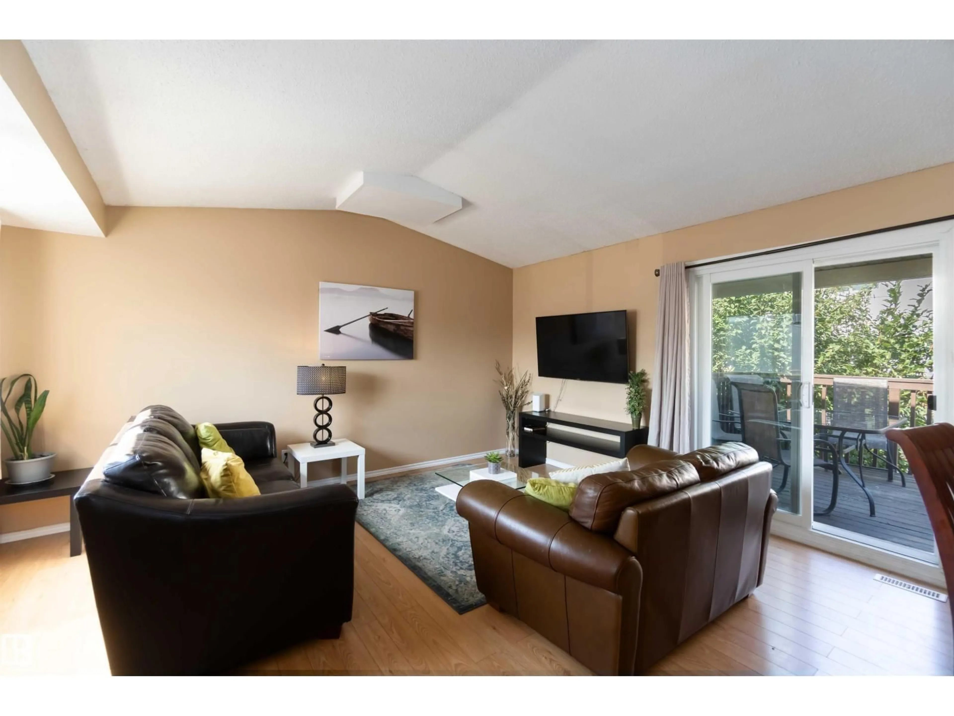 Living room with furniture, wood/laminate floor for 546 WILLOW CO, Edmonton Alberta T5T2K7