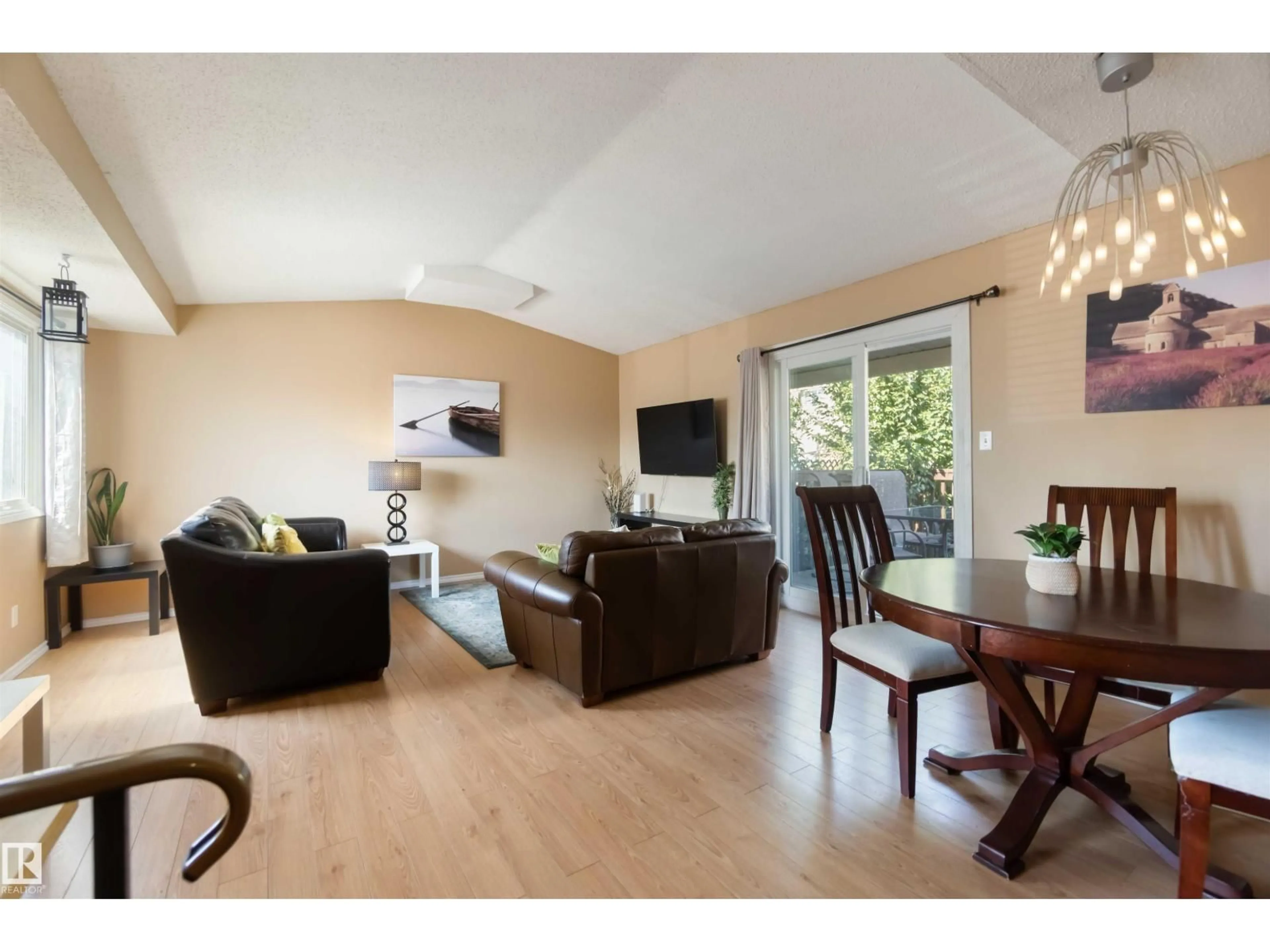Living room with furniture, wood/laminate floor for 546 WILLOW CO, Edmonton Alberta T5T2K7