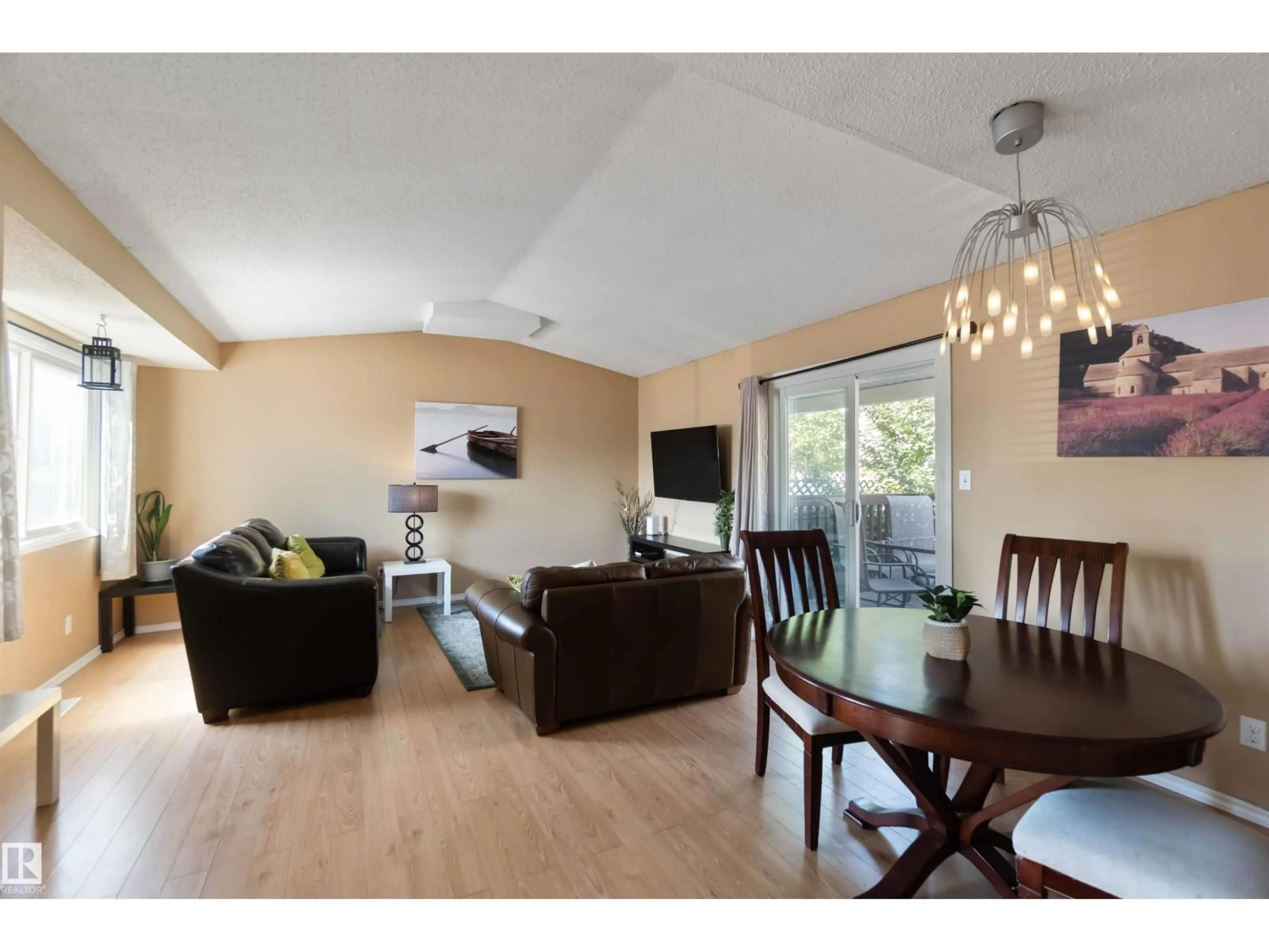 Living room with furniture, wood/laminate floor for 546 WILLOW CO, Edmonton Alberta T5T2K7