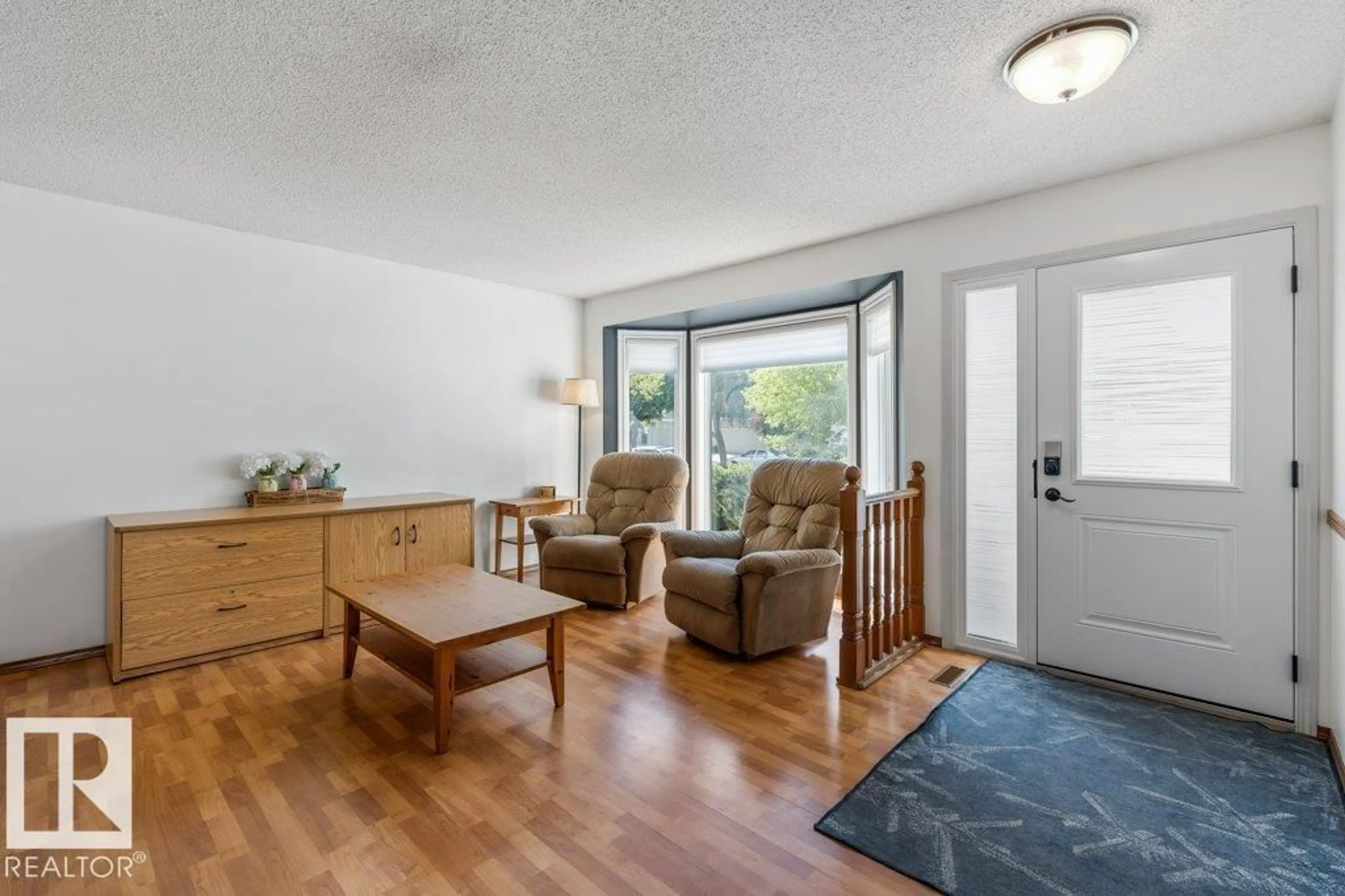 Living room with furniture, wood/laminate floor for 51 ALDERWOOD BLVD, St. Albert Alberta T8N3M4