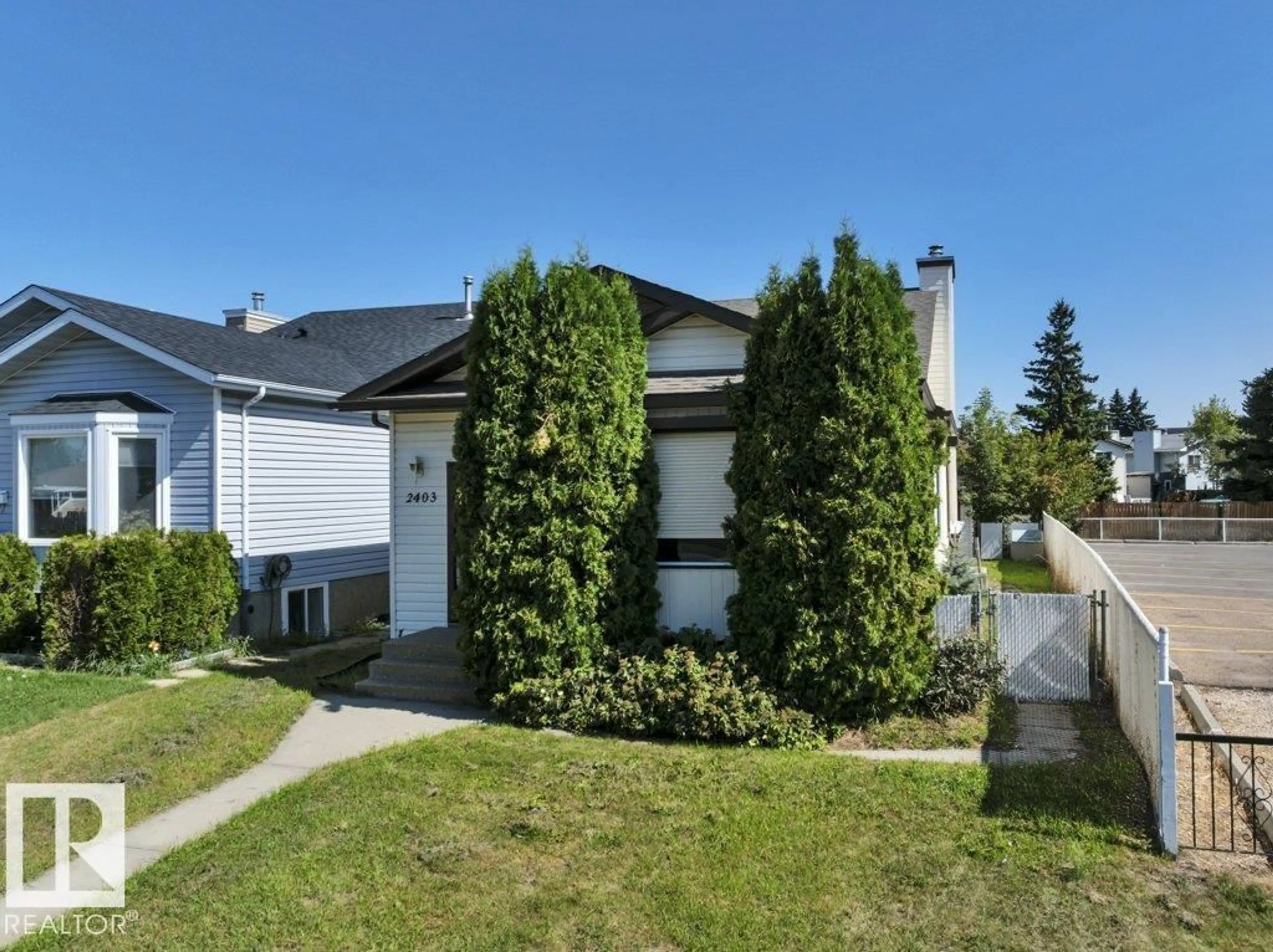 Home with vinyl exterior material, street for 2403 47 ST, Edmonton Alberta T6L4P6