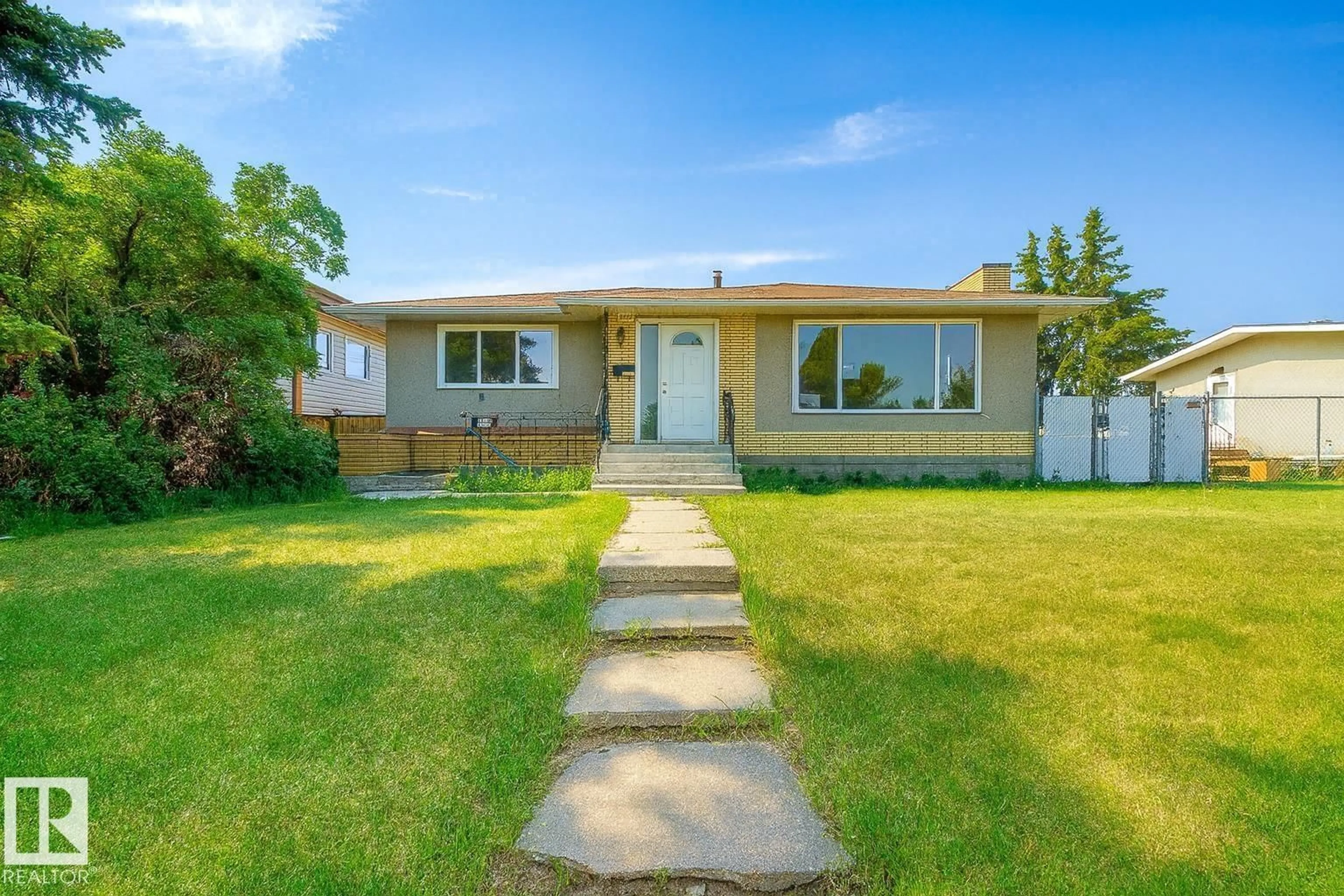 Home with vinyl exterior material, street for 8911 132 AV NW, Edmonton Alberta T5X0X9