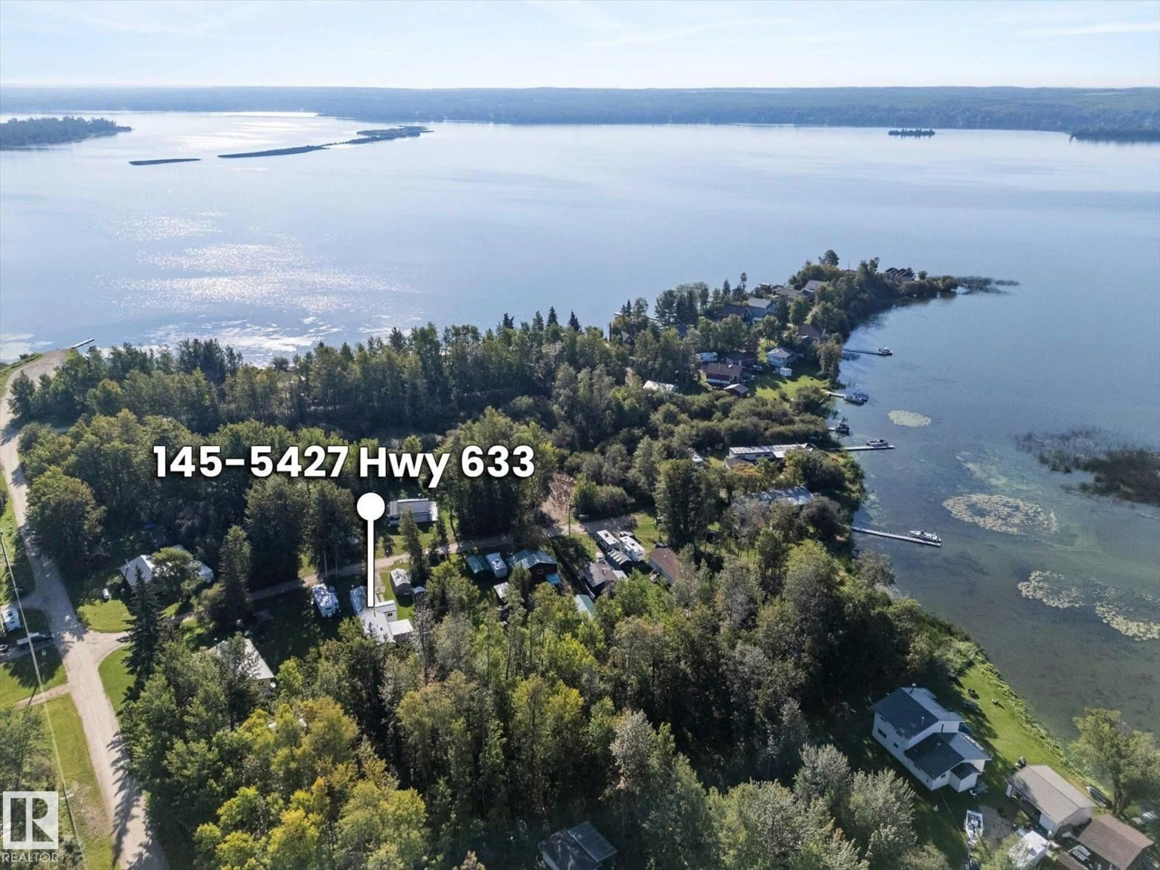 A pic from outside/outdoor area/front of a property/back of a property/a pic from drone, water/lake/river/ocean view for #147 - 5427 HWY 633, Rural Lac Ste. Anne County Alberta T0E1M0