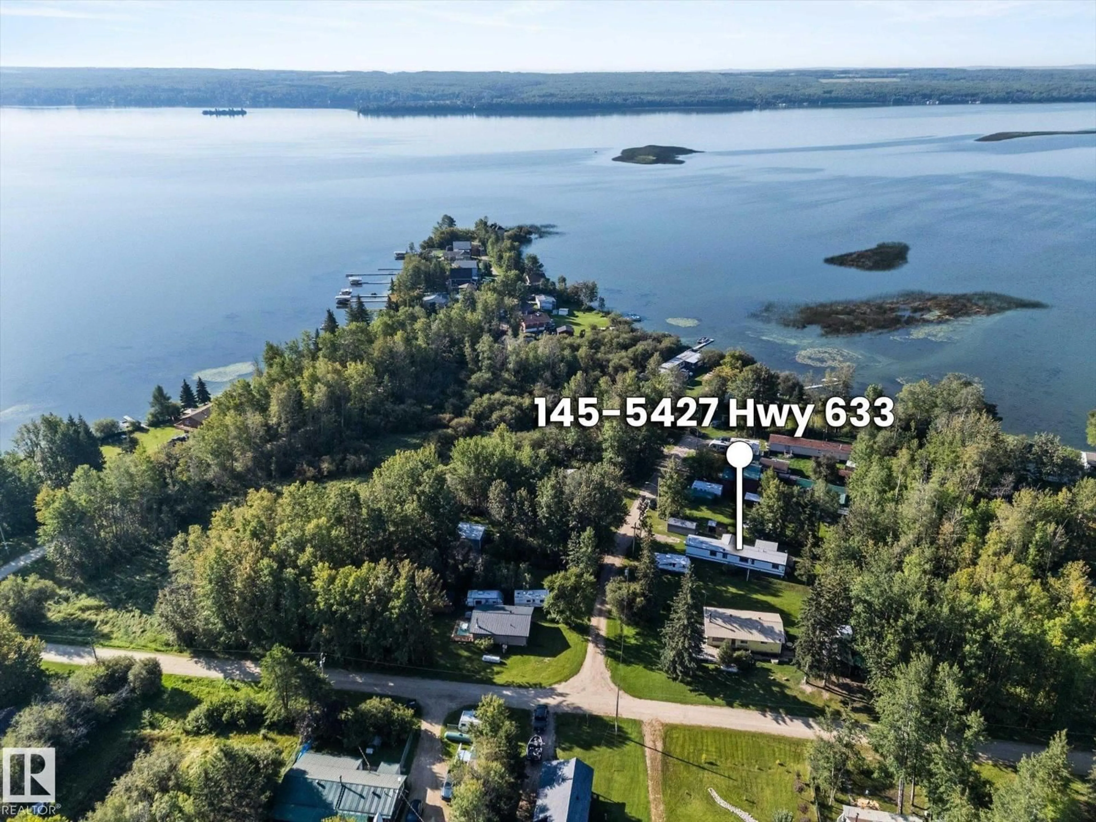 A pic from outside/outdoor area/front of a property/back of a property/a pic from drone, water/lake/river/ocean view for #147 - 5427 HWY 633, Rural Lac Ste. Anne County Alberta T0E1M0