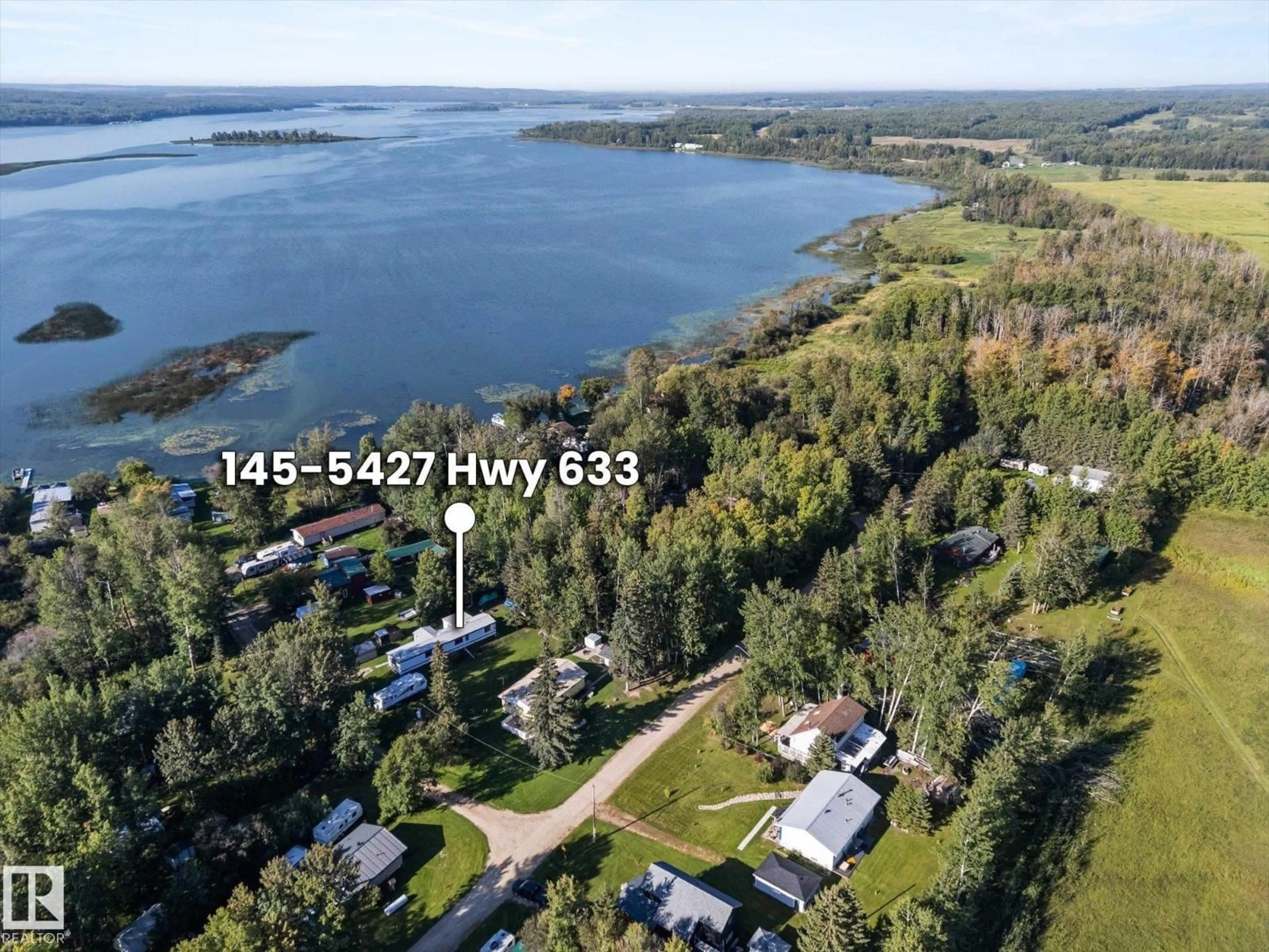 A pic from outside/outdoor area/front of a property/back of a property/a pic from drone, water/lake/river/ocean view for #147 - 5427 HWY 633, Rural Lac Ste. Anne County Alberta T0E1M0