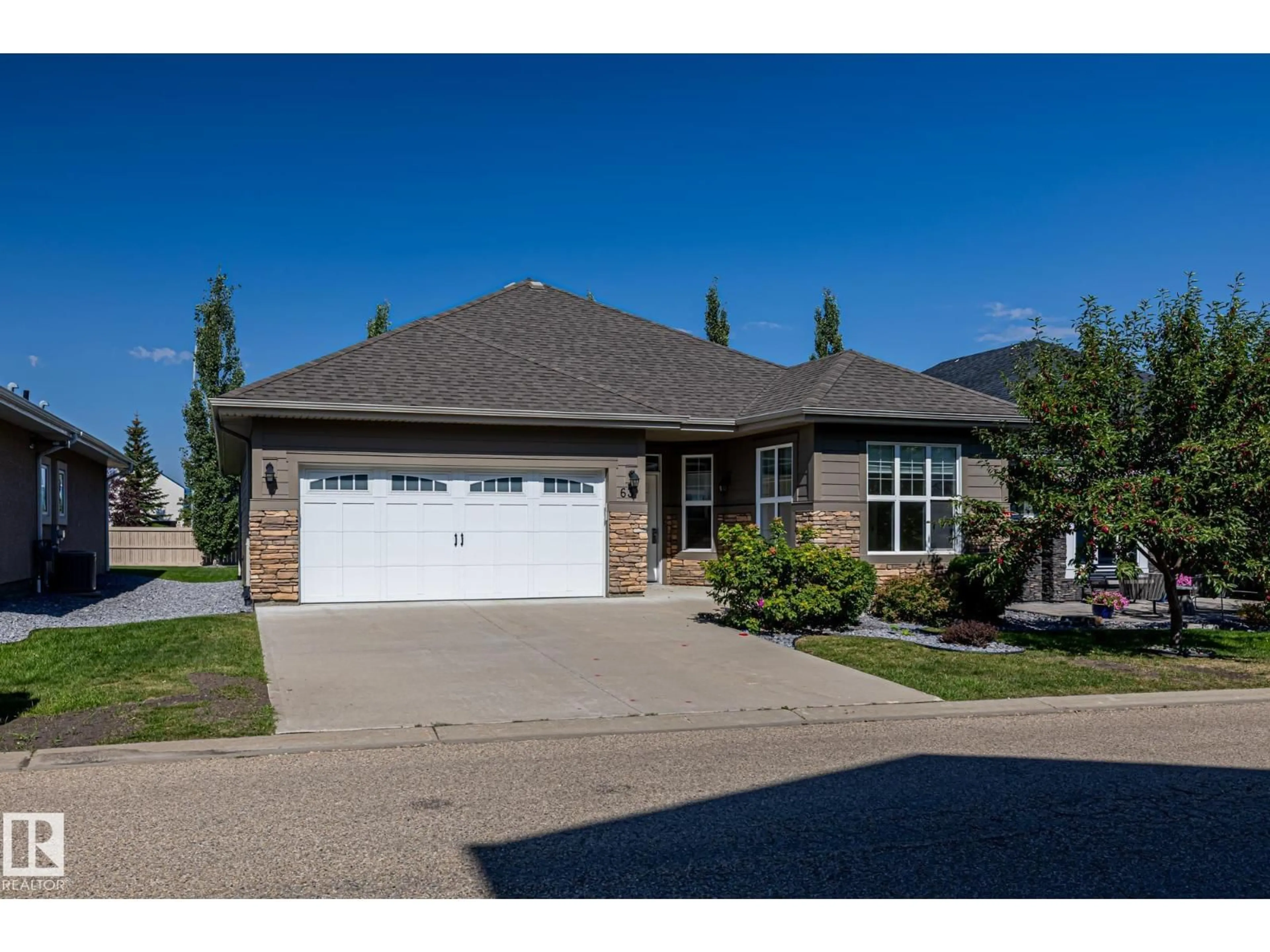 Home with brick exterior material, street for 18343 - 63 LESSARD RD, Edmonton Alberta T6M2Y5