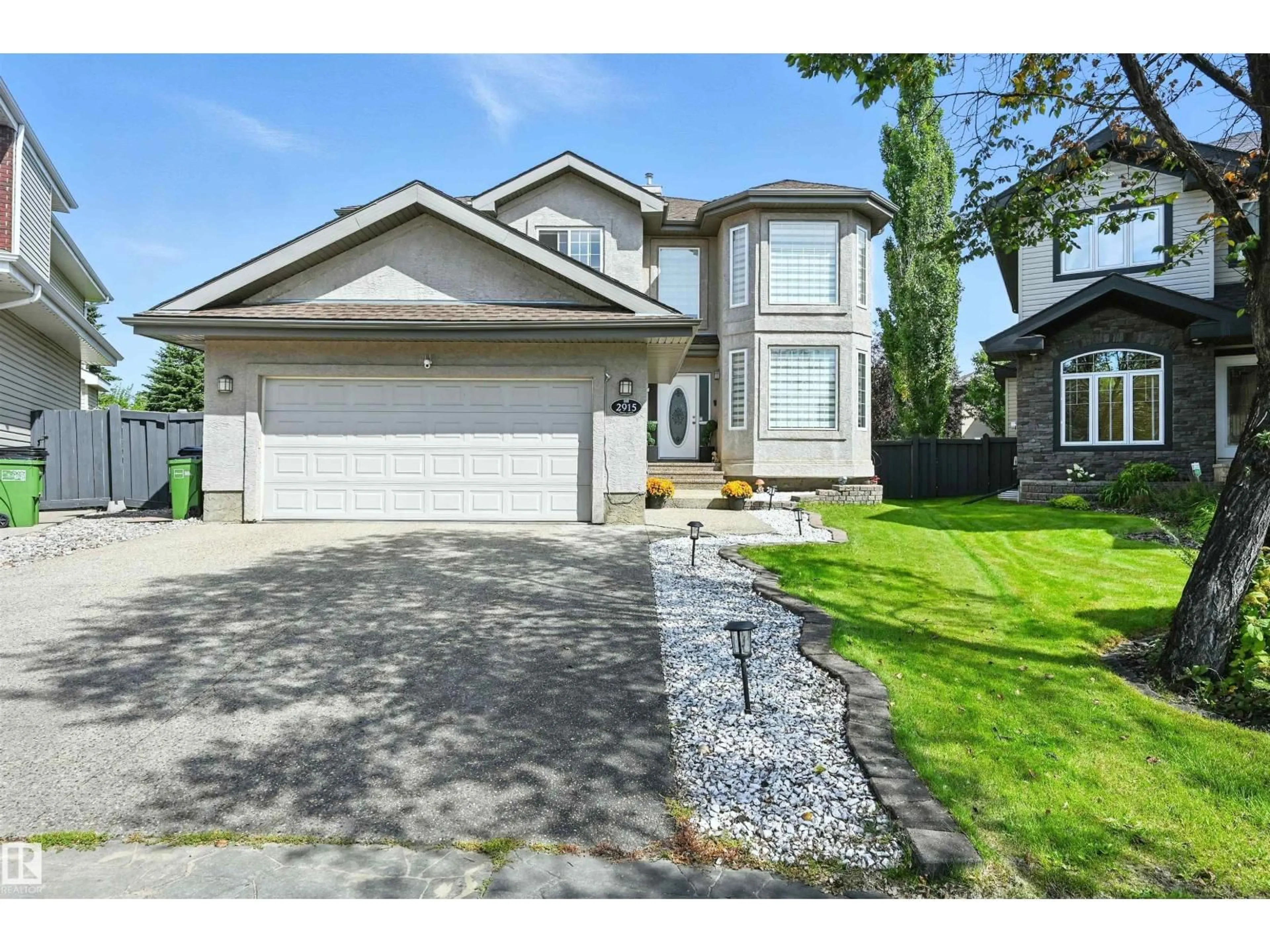 Home with vinyl exterior material, street for NW - 2915 TREDGER GREEN GR, Edmonton Alberta T6R3R7