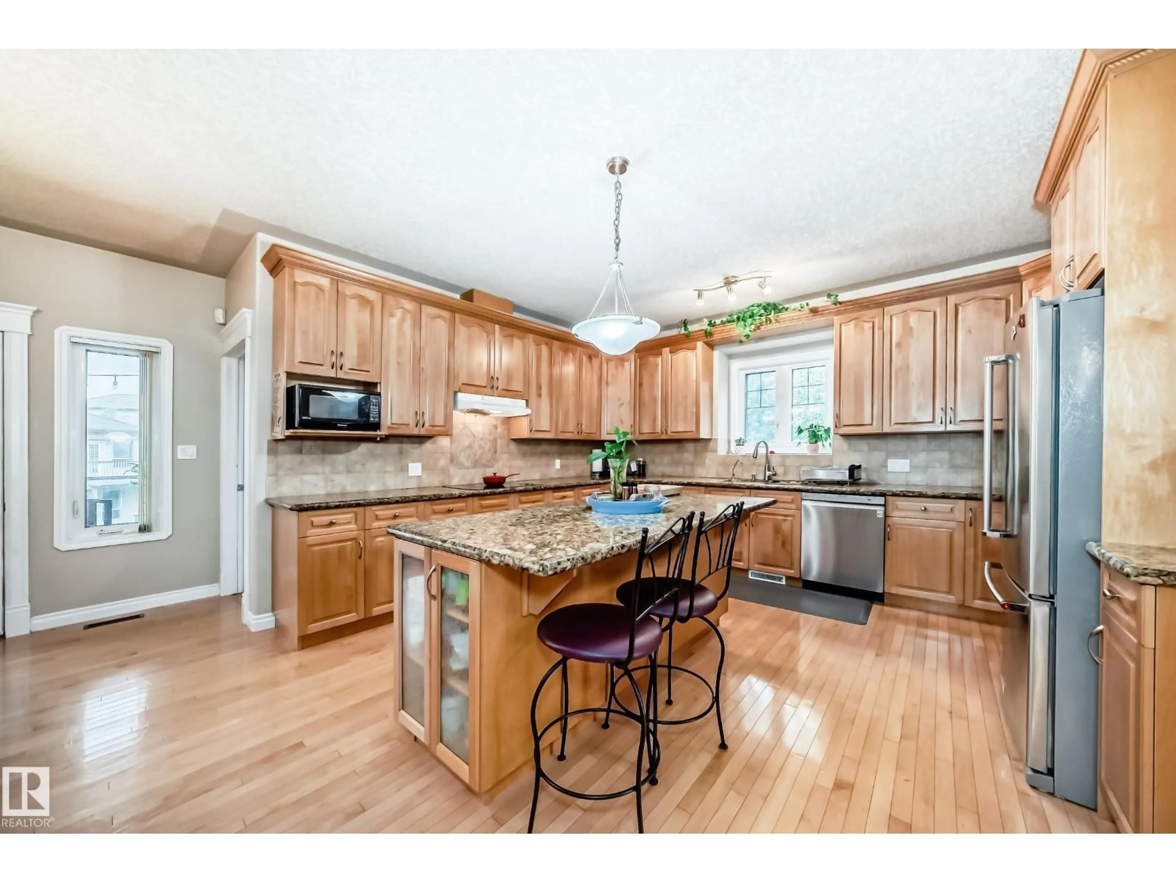 Open concept kitchen, wood/laminate floor for 1436 BISHOP PT, Edmonton Alberta T6W1H3