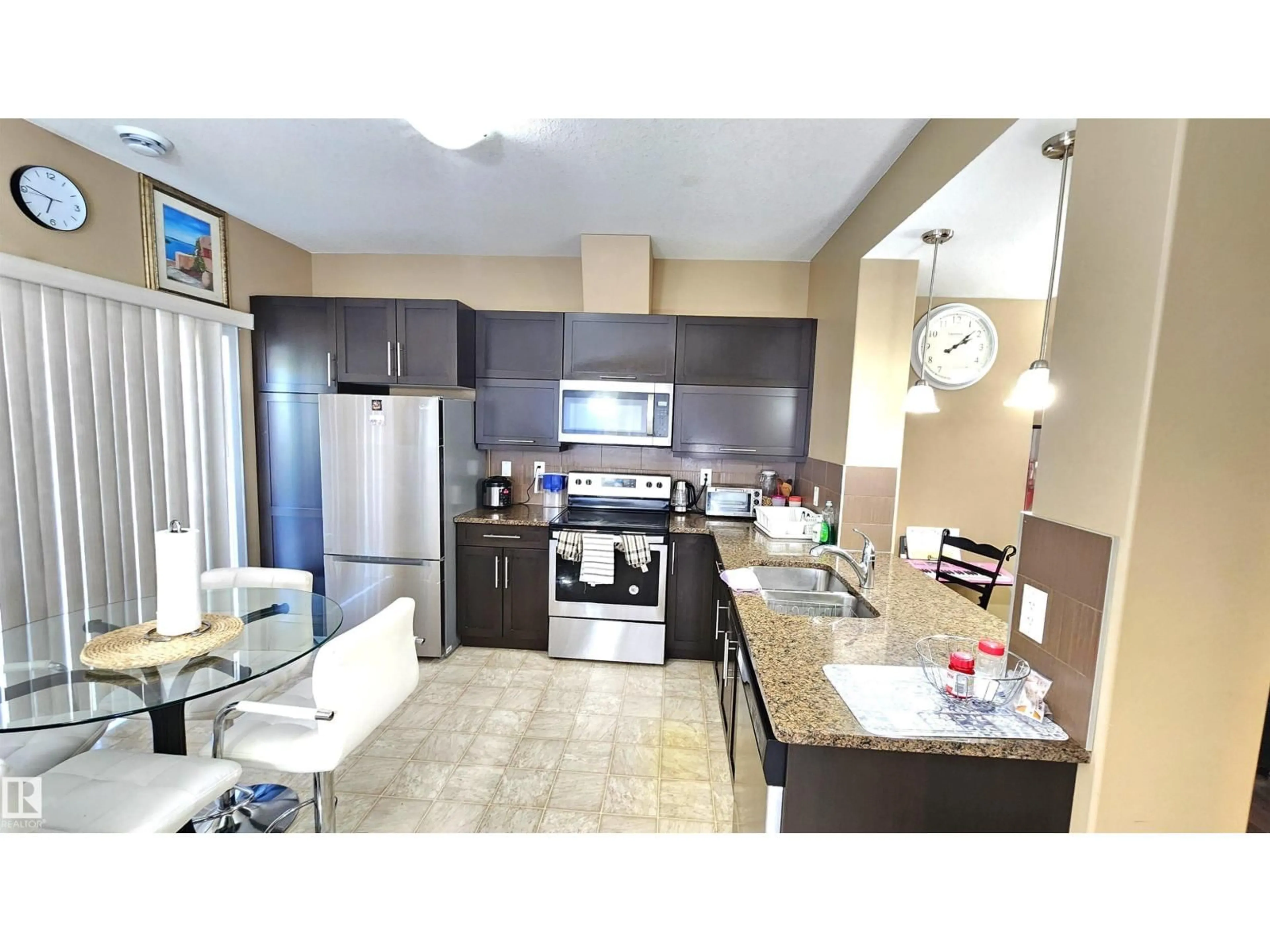 Open concept kitchen, ceramic/tile floor for #40 - 13003 132 AV, Edmonton Alberta T5L3R2