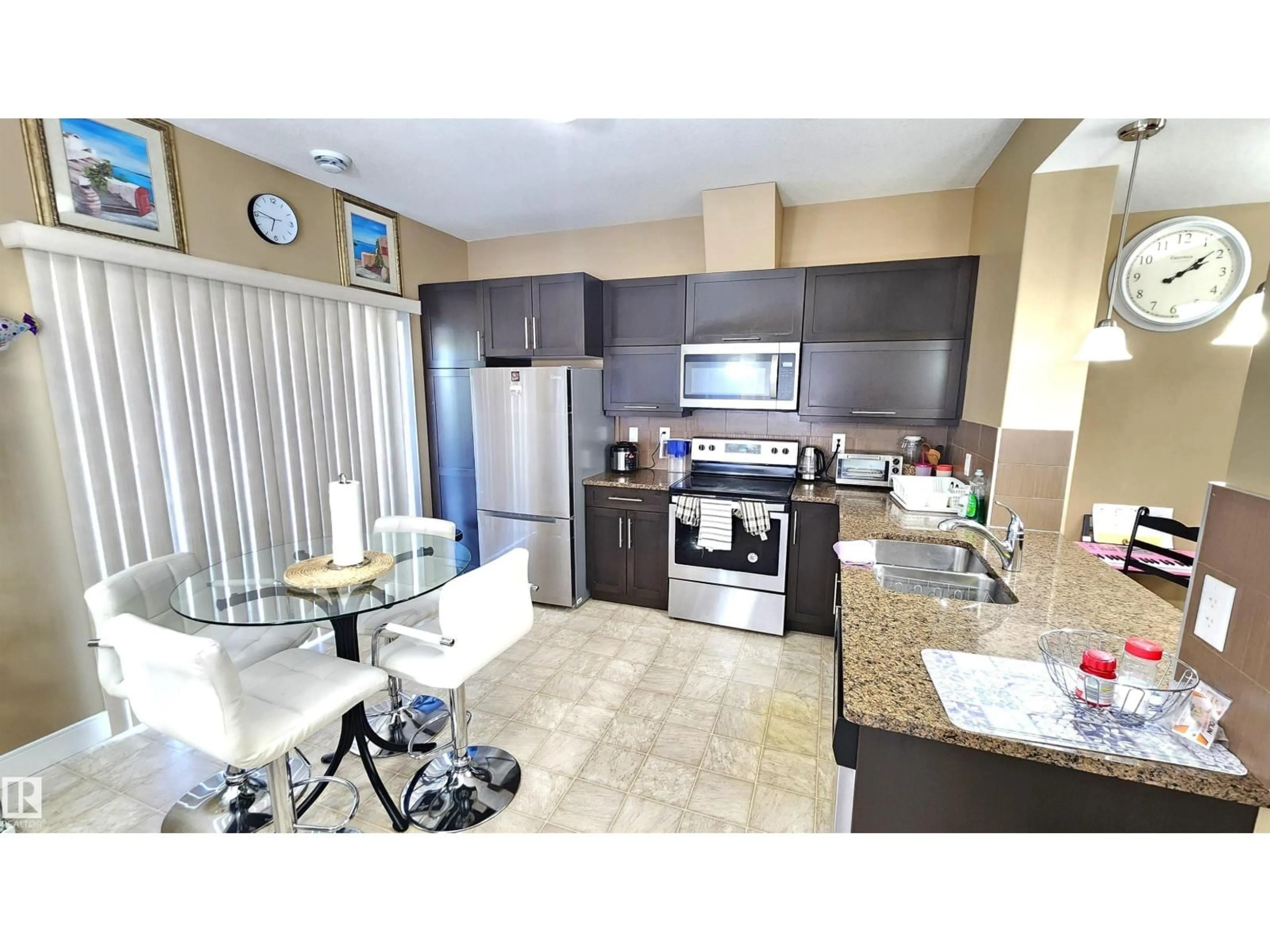 Open concept kitchen, ceramic/tile floor for #40 - 13003 132 AV, Edmonton Alberta T5L3R2