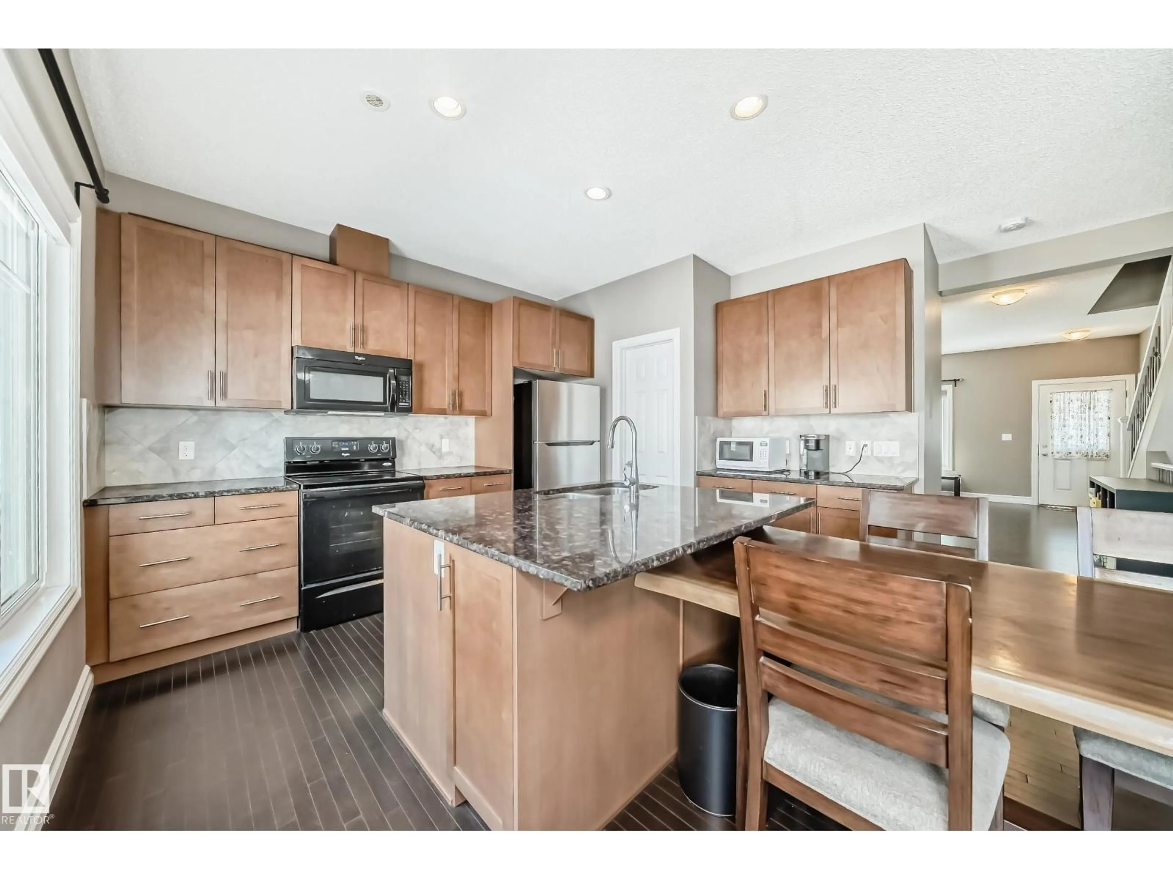 Open concept kitchen, wood/laminate floor for 2003 - 6 RABBIT HILL RD, Edmonton Alberta T6R0R7