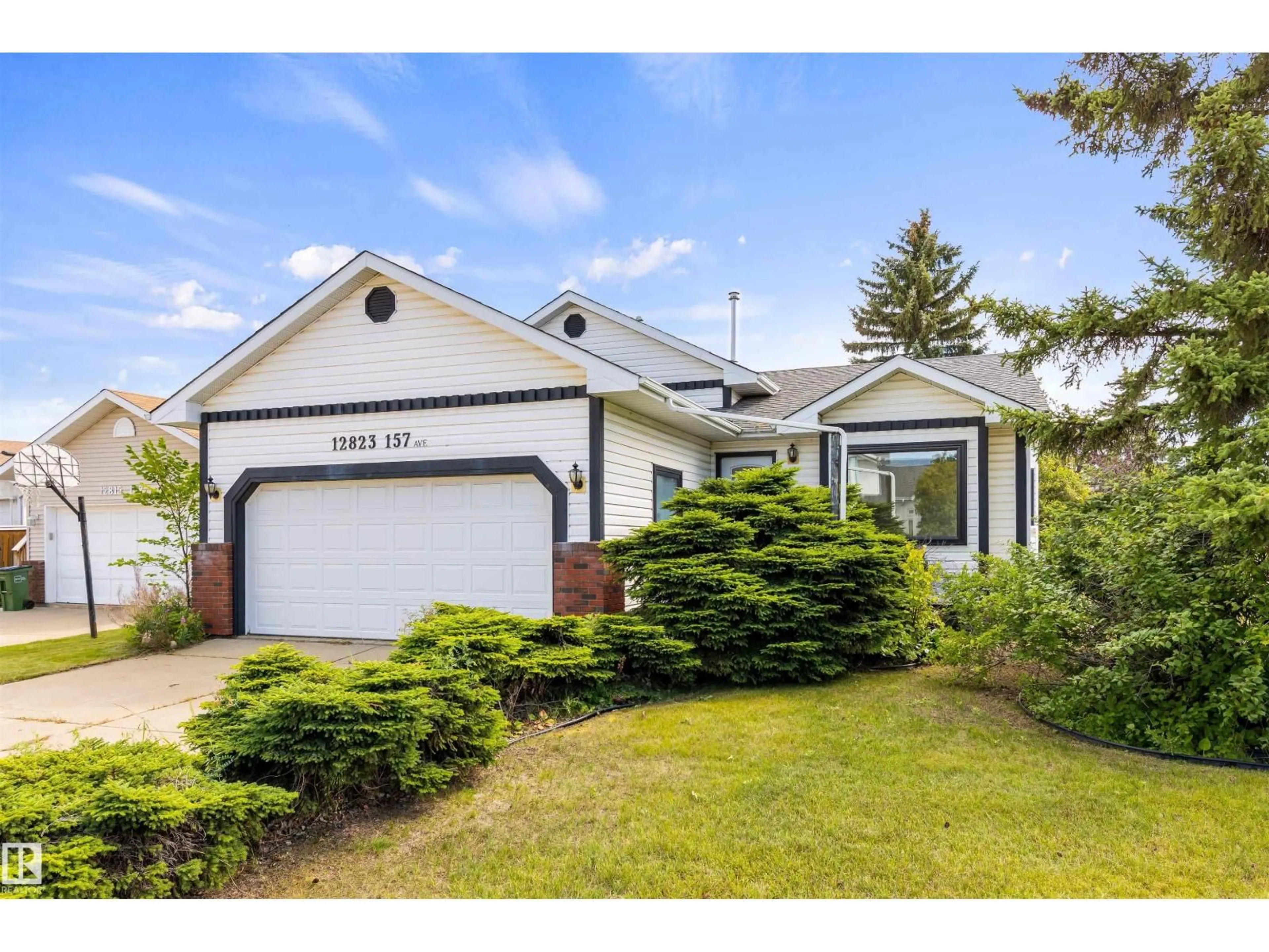 Home with vinyl exterior material, street for 12823 157 AV, Edmonton Alberta T6V1A9