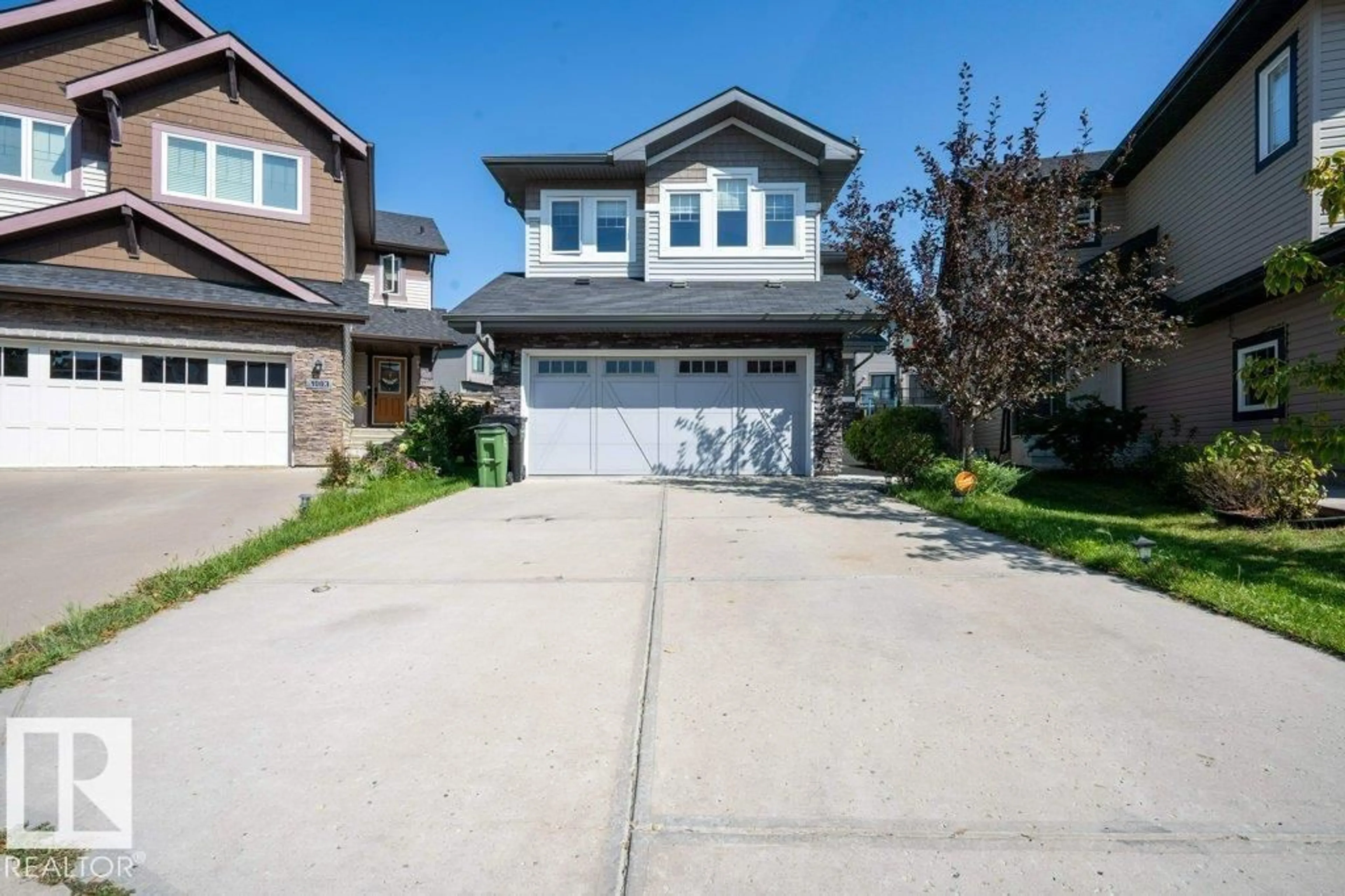 Home with vinyl exterior material, street for SW - 1007 158 ST, Edmonton Alberta T6W2S4