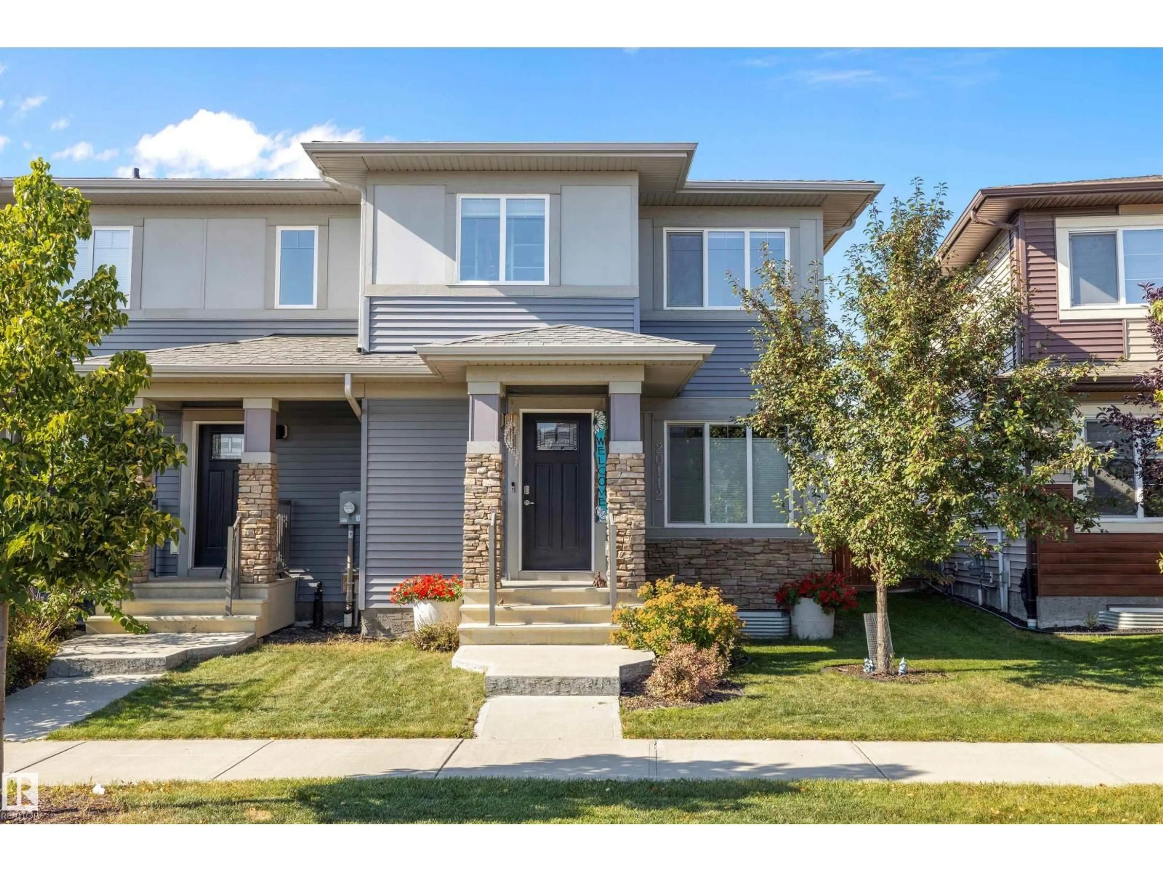 Home with brick exterior material, street for 20112 27 AV, Edmonton Alberta T6M0W7