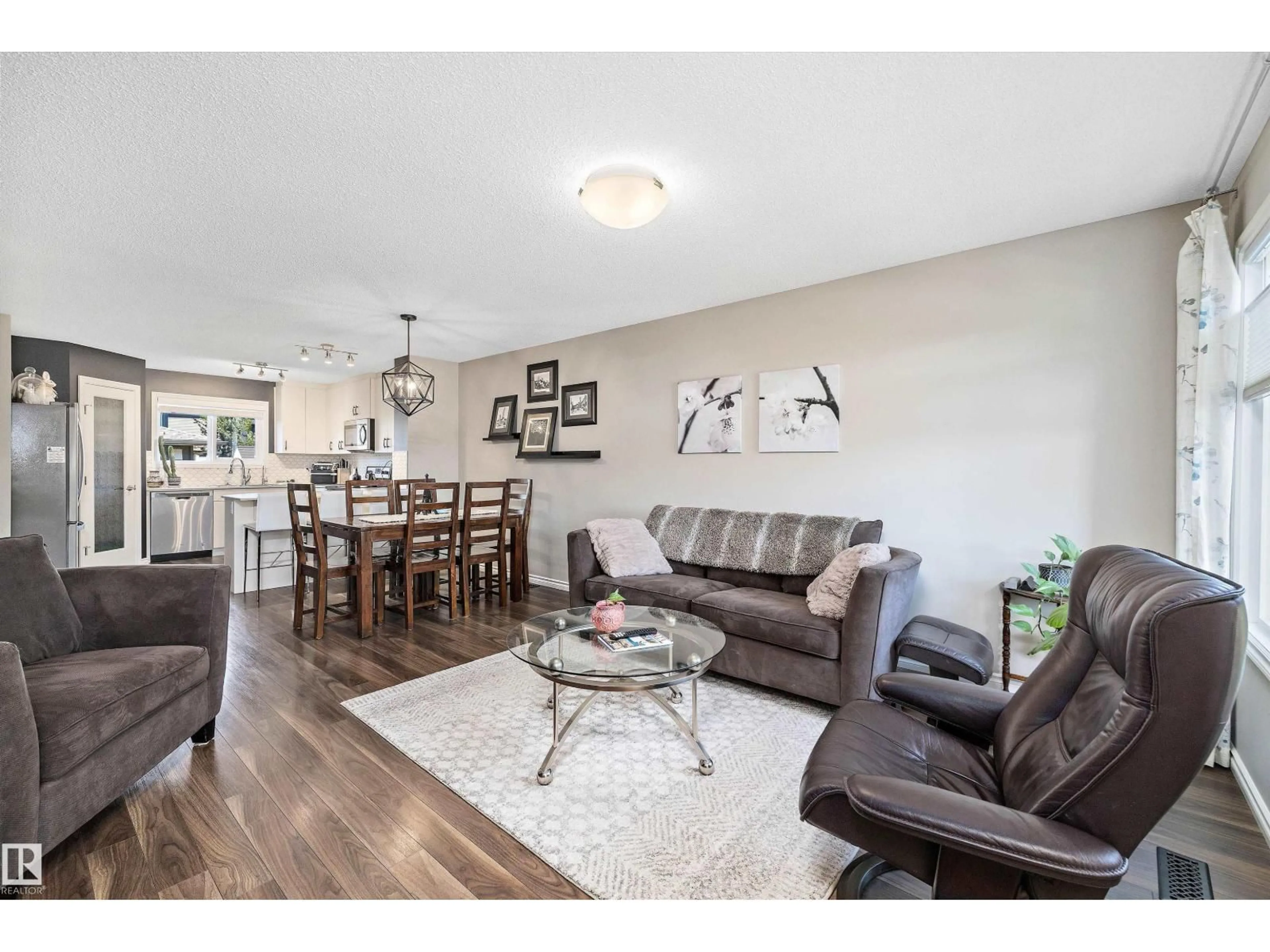 Living room with furniture, wood/laminate floor for 20112 27 AV, Edmonton Alberta T6M0W7