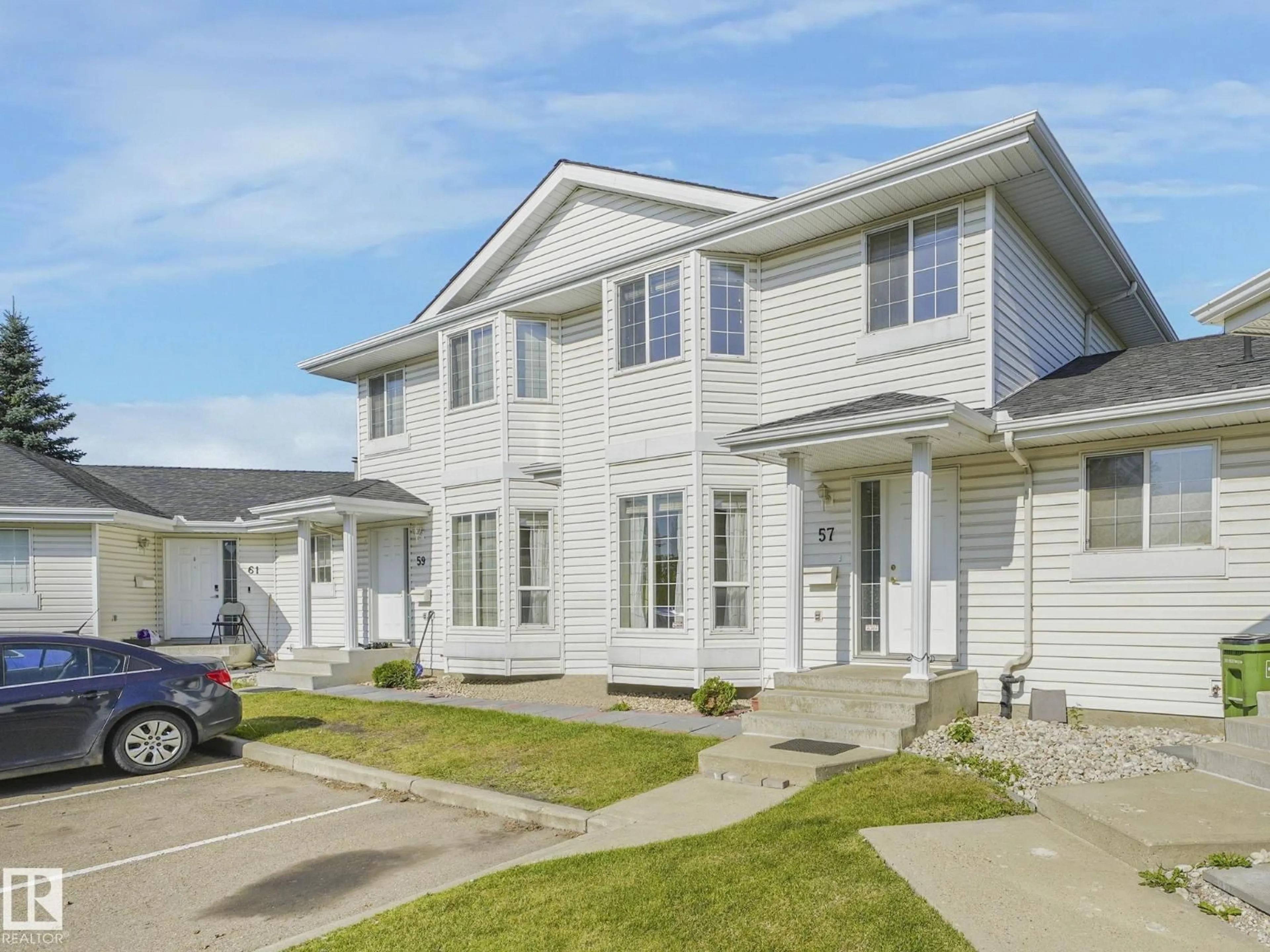 Home with vinyl exterior material, street for 57 - 3380 28A AV, Edmonton Alberta T6T1V4