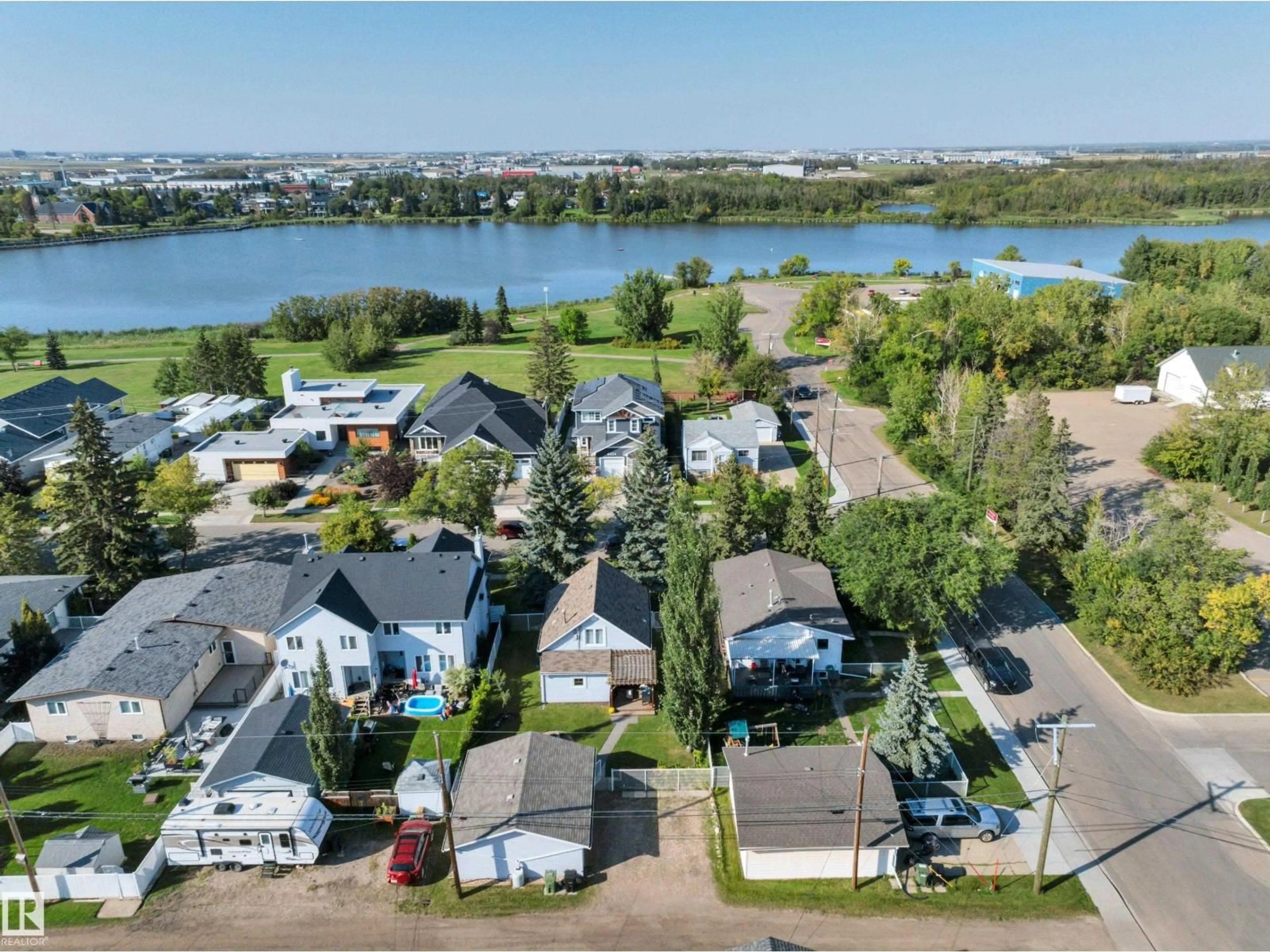 A pic from outside/outdoor area/front of a property/back of a property/a pic from drone, water/lake/river/ocean view for 4403 47 AV, Leduc Alberta T9E5T3