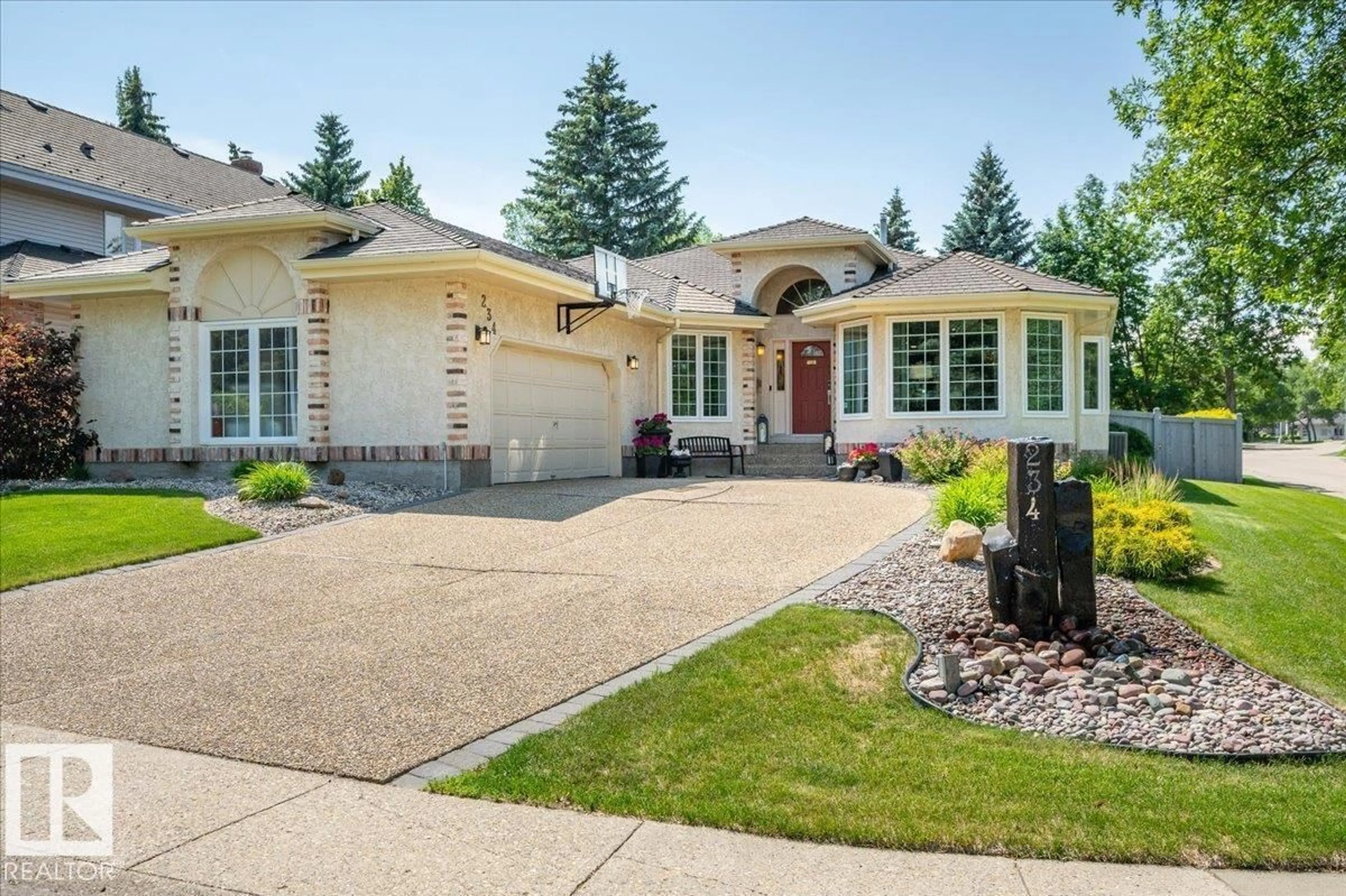 Home with vinyl exterior material, street for 234 OMAND DR, Edmonton Alberta T6R1L3