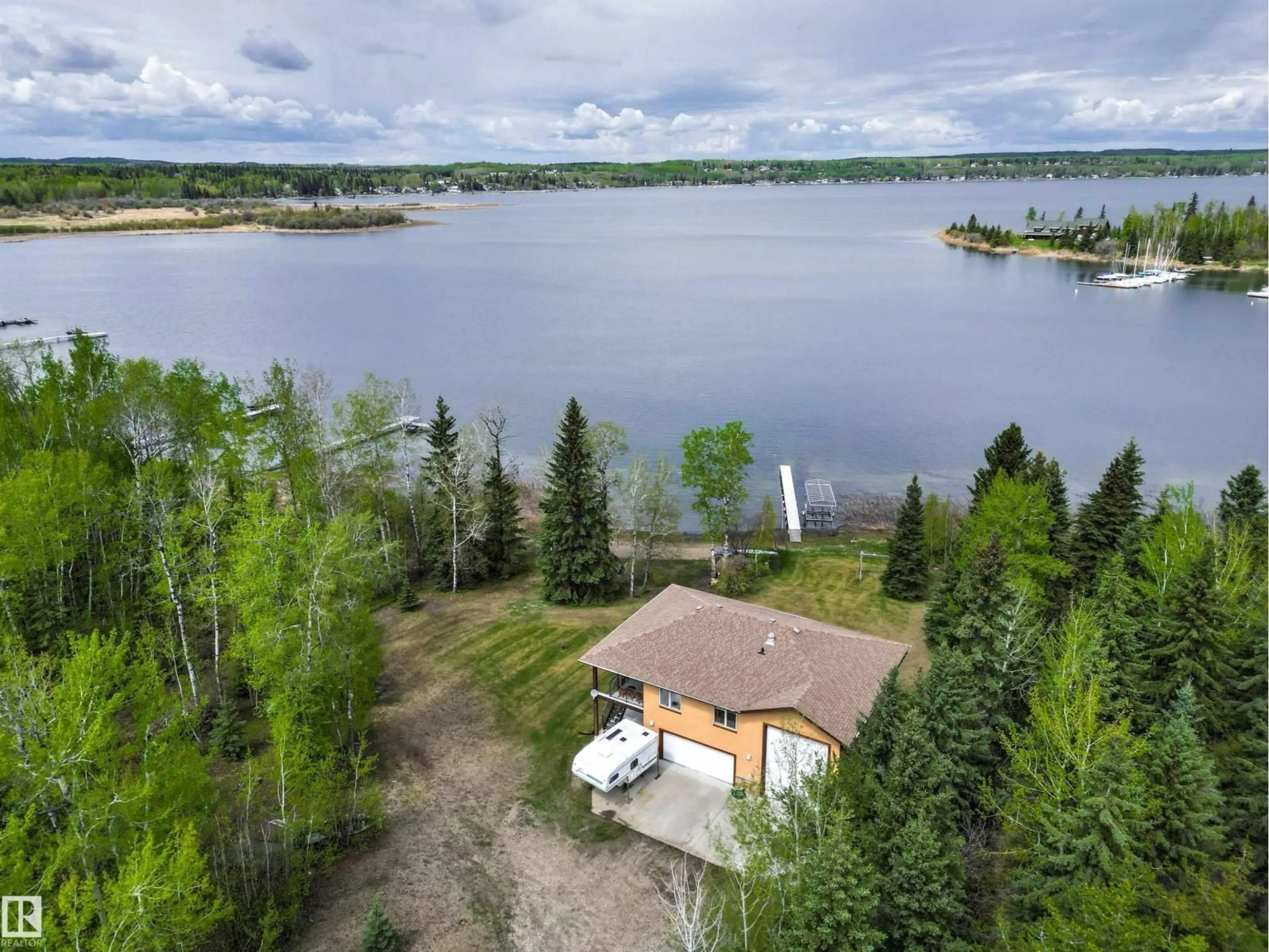 A pic from outside/outdoor area/front of a property/back of a property/a pic from drone, water/lake/river/ocean view for 4 SUNSHINE BAY RD, Rural Parkland County Alberta T0E0V0