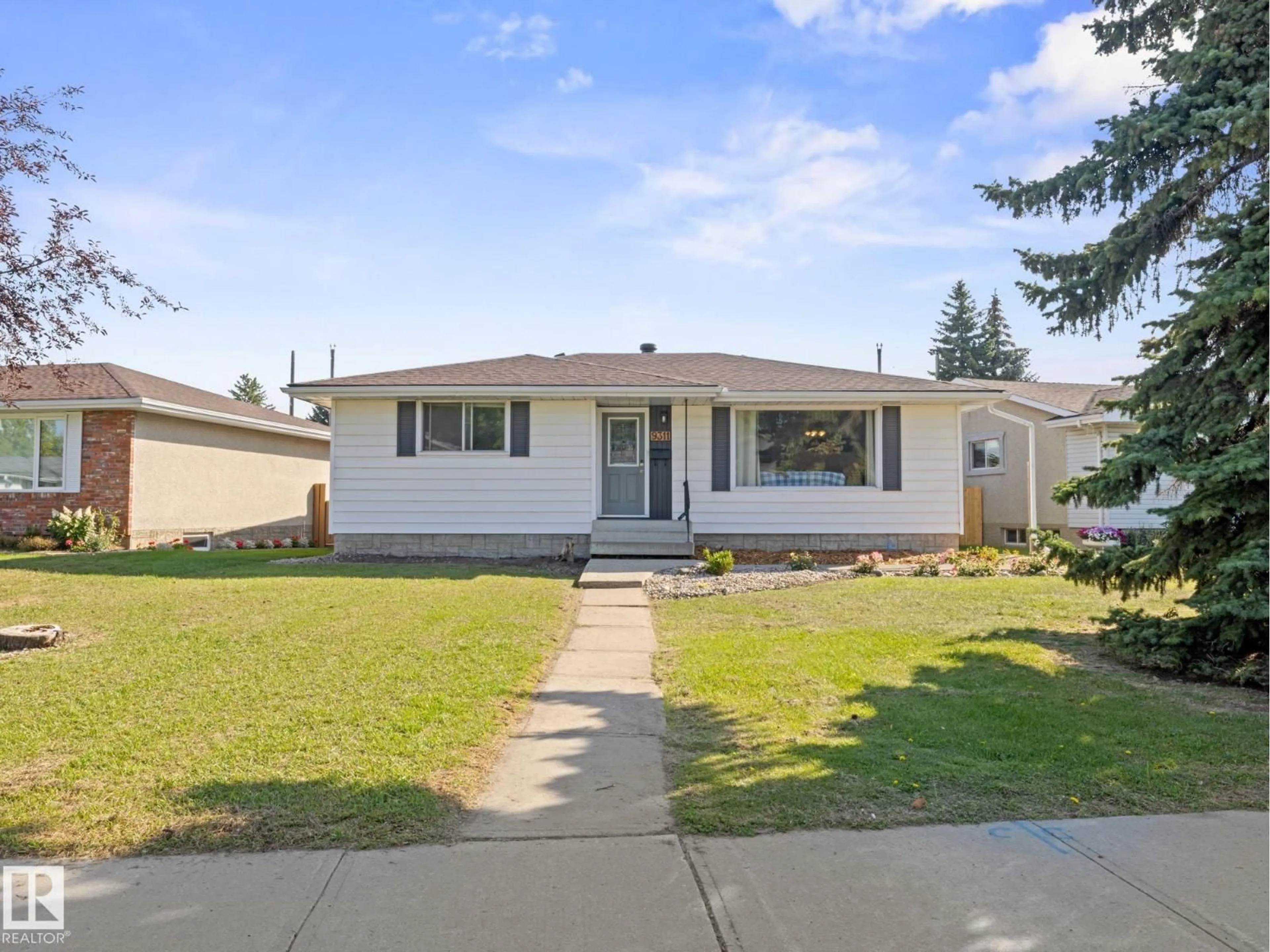 Home with vinyl exterior material, street for 9311 169 ST, Edmonton Alberta T5R2X4