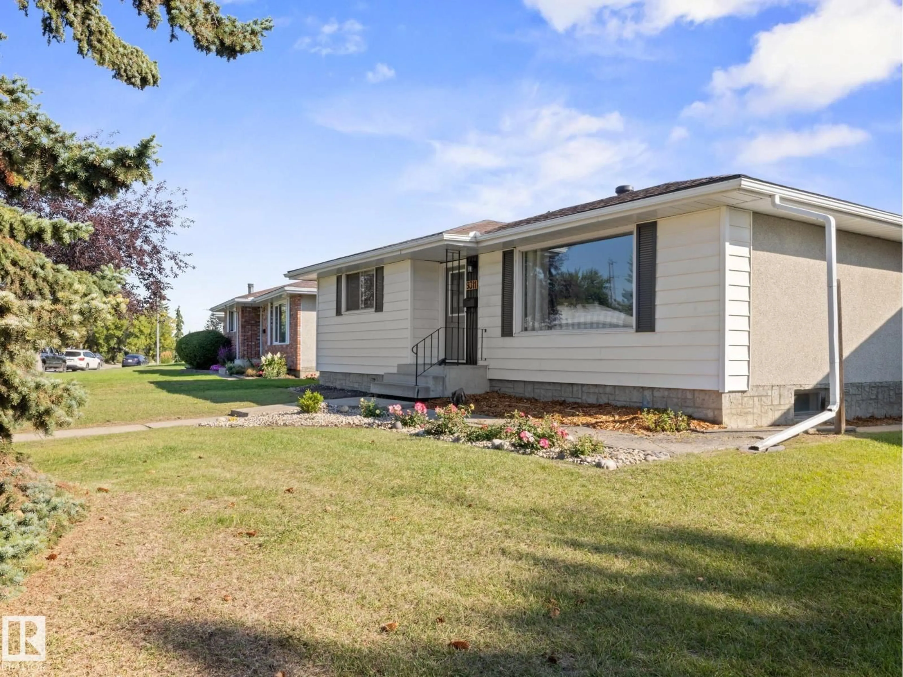 Home with vinyl exterior material, street for 9311 169 ST, Edmonton Alberta T5R2X4